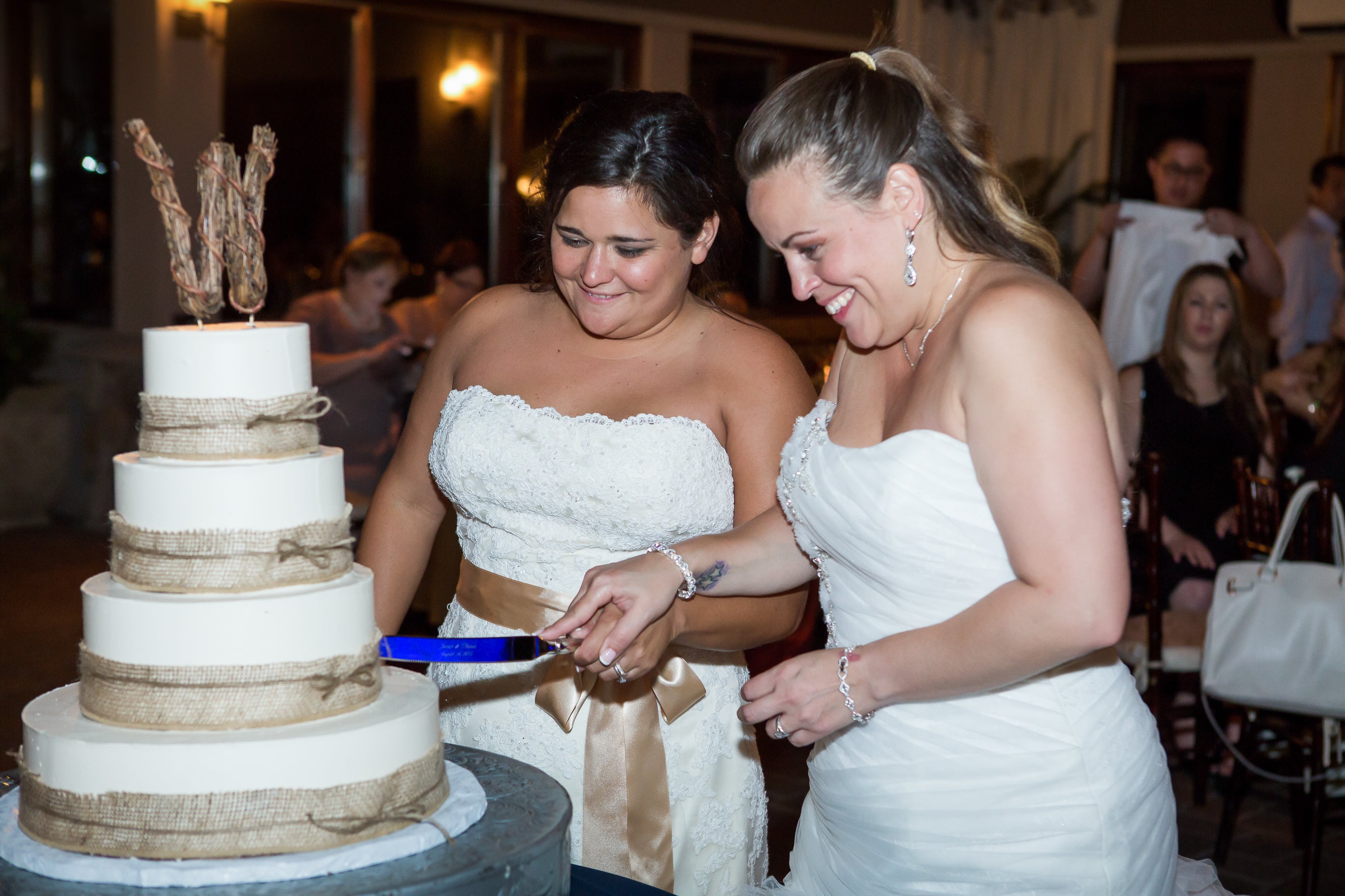 Brides cutting their wedding cake