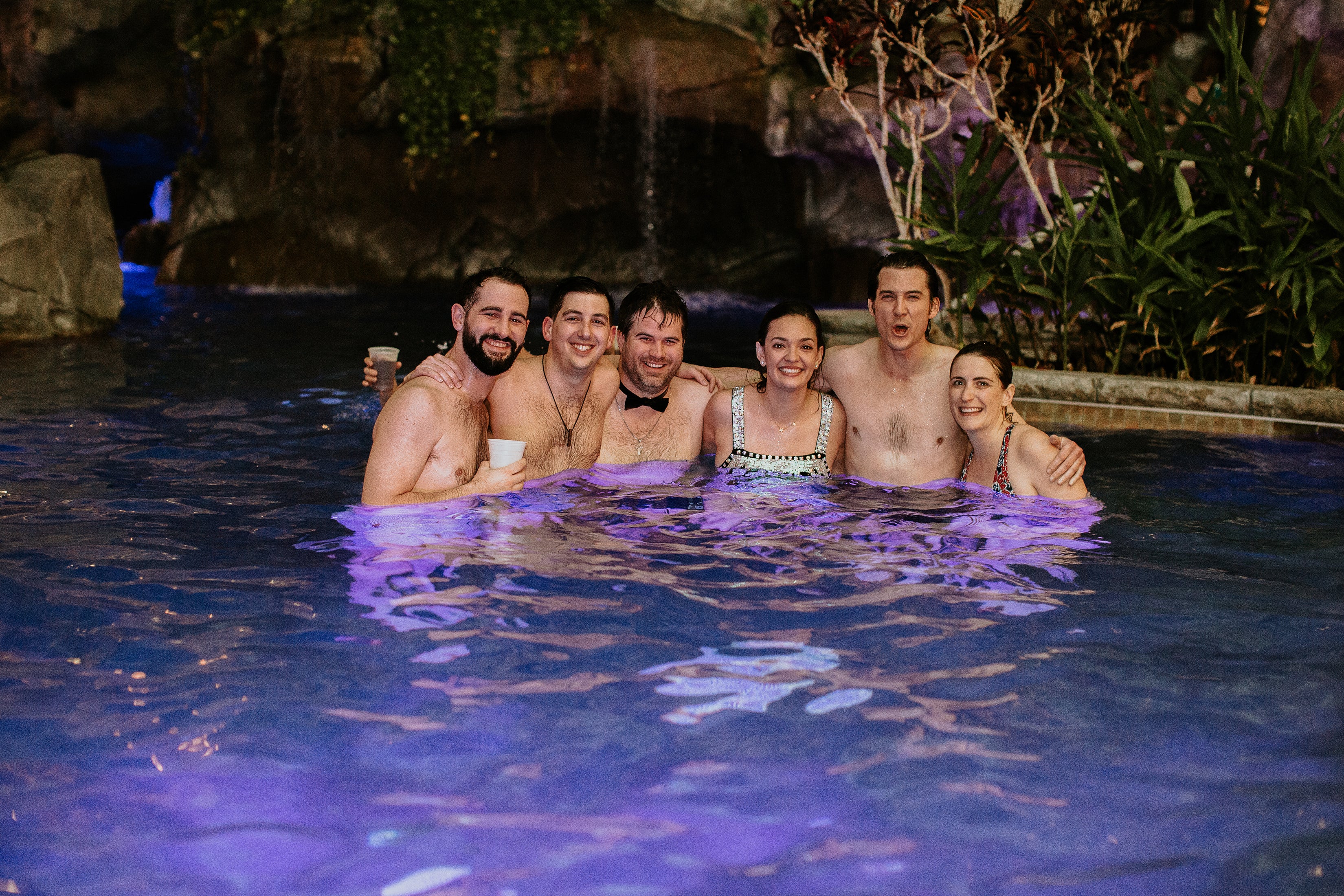 Wedding party in pool at Biosphere
