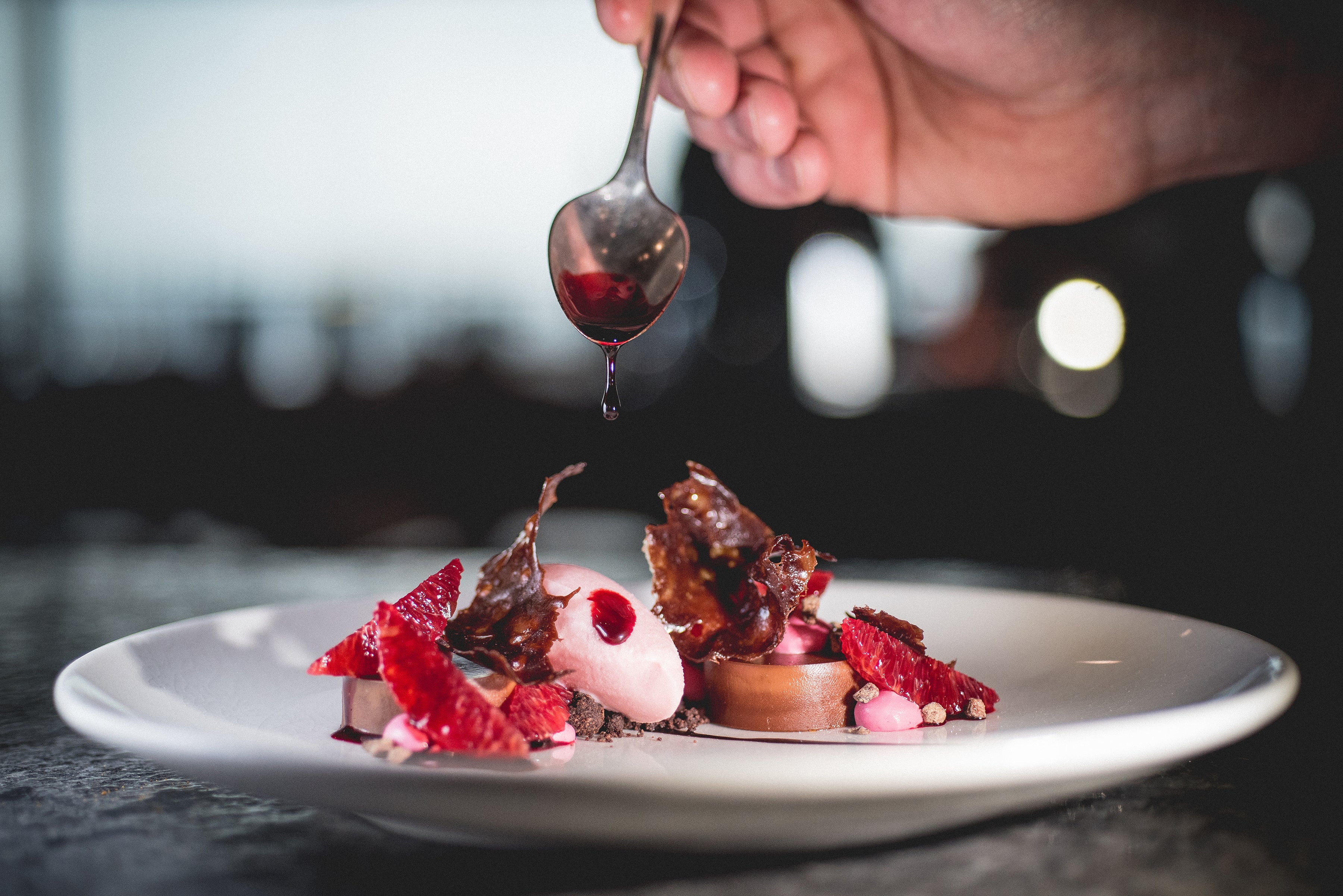 Chef plating a dessert