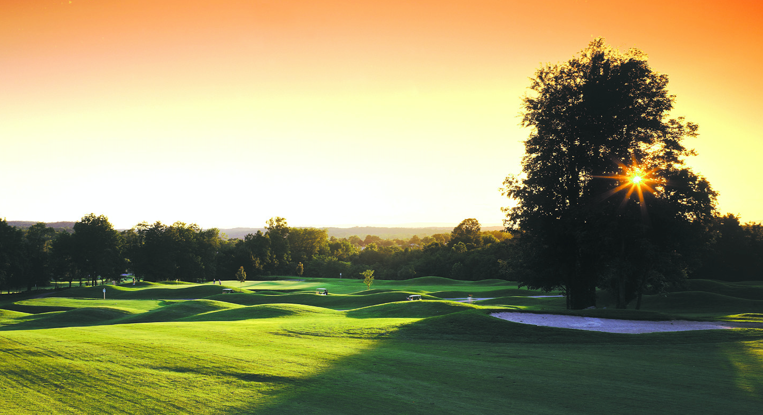 A sunset over the golf course at Black Bear at Crystal Springs Resort