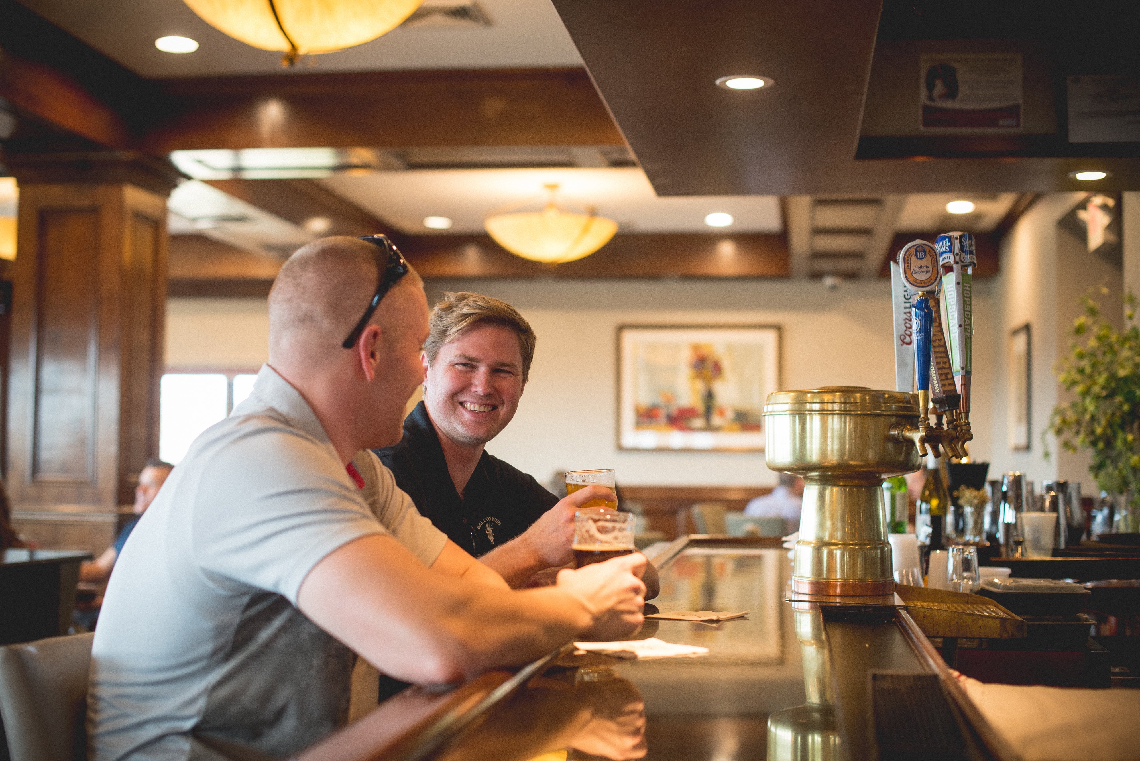 Men enjoying drinks at Crystal Tavern bar