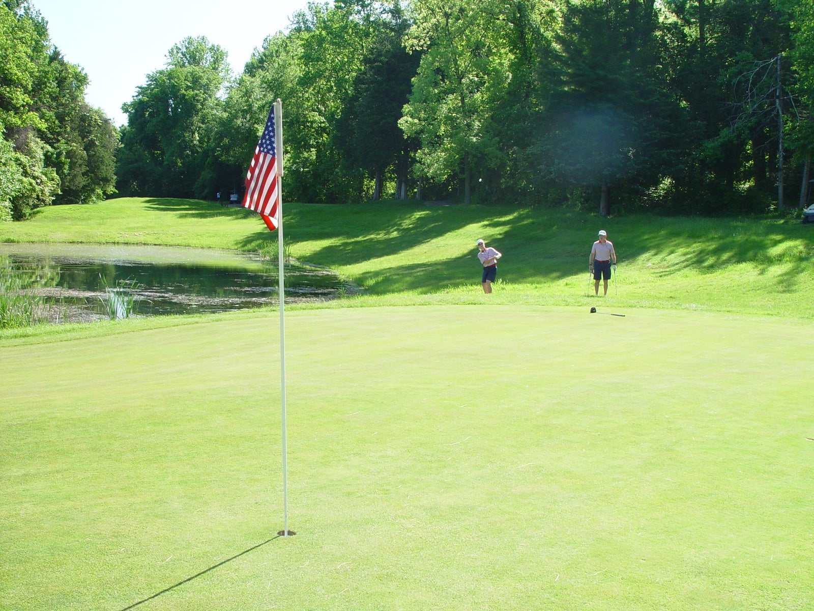 Two golfers on the green of  Minerals Golf Club at Crystal Springs Resort