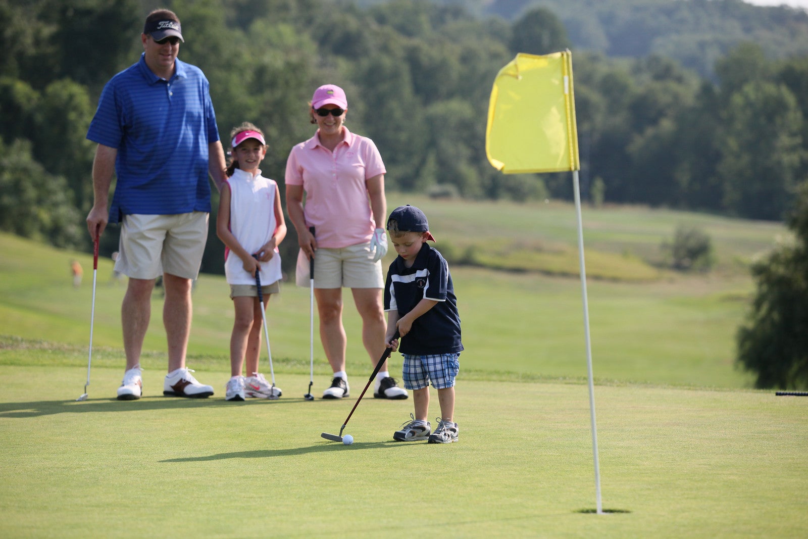 Family golfing at Minerals Golf Course at Crystal Springs Resort