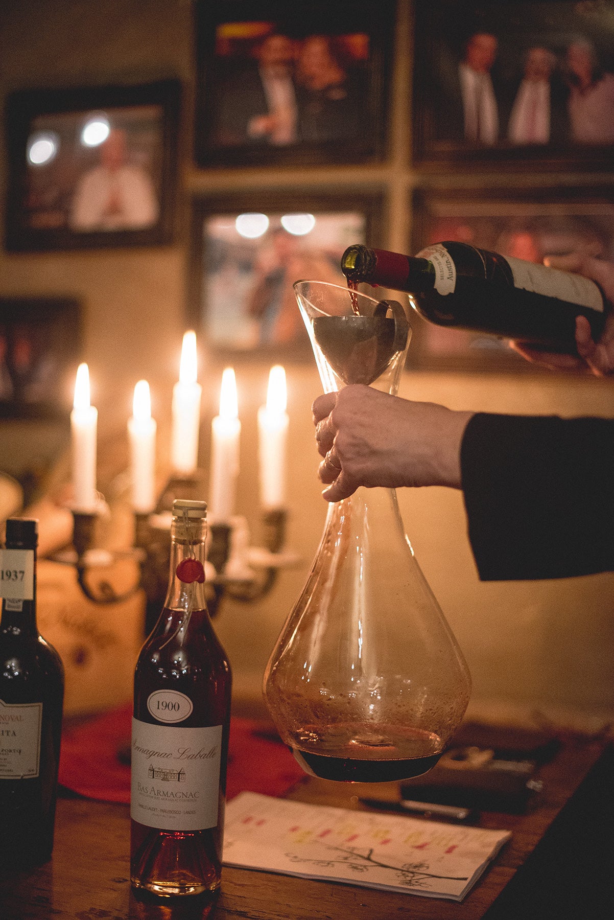Susanne Wagner pouring wine into a decanter.