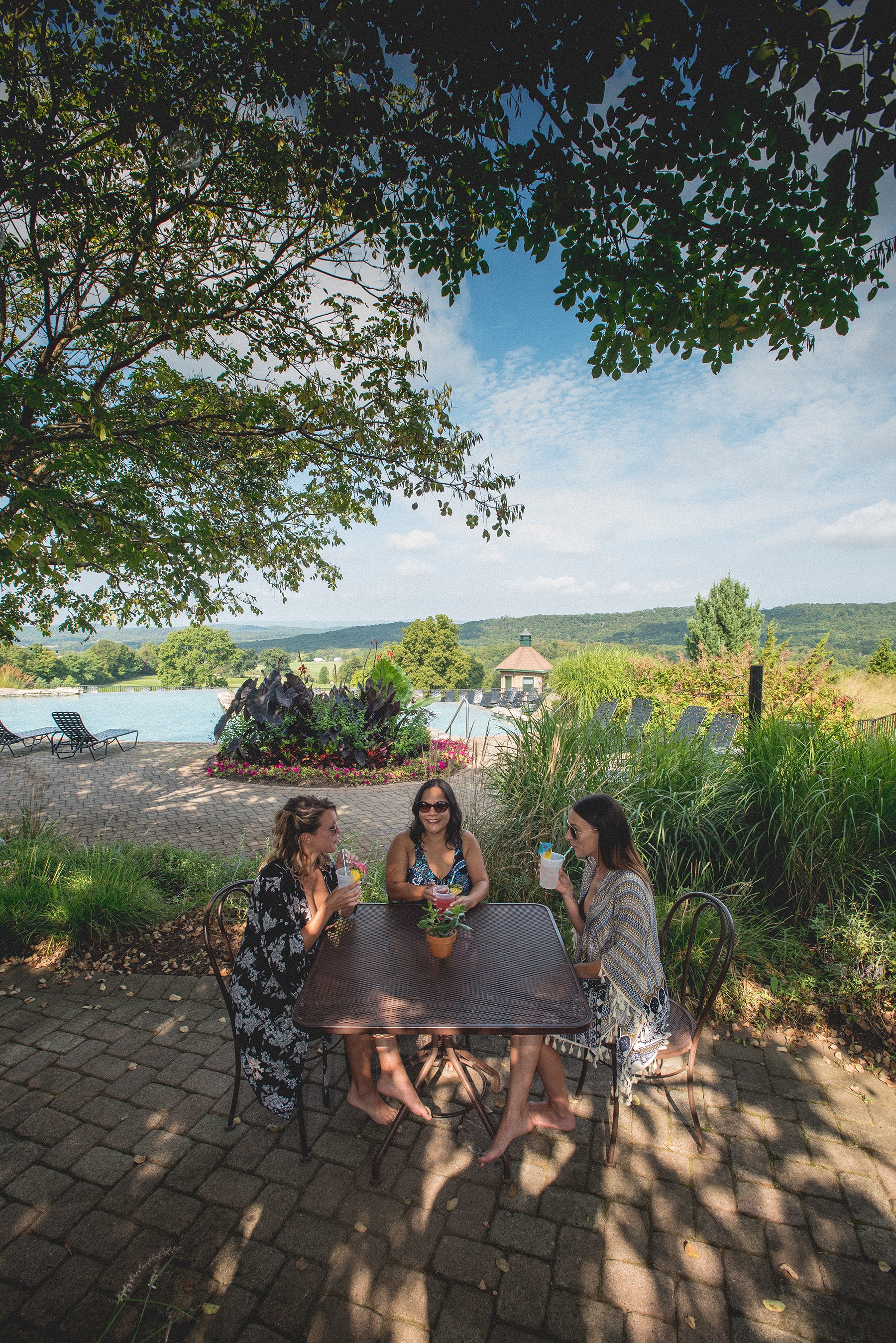 Girlfriends sipping cocktails at Vista 180