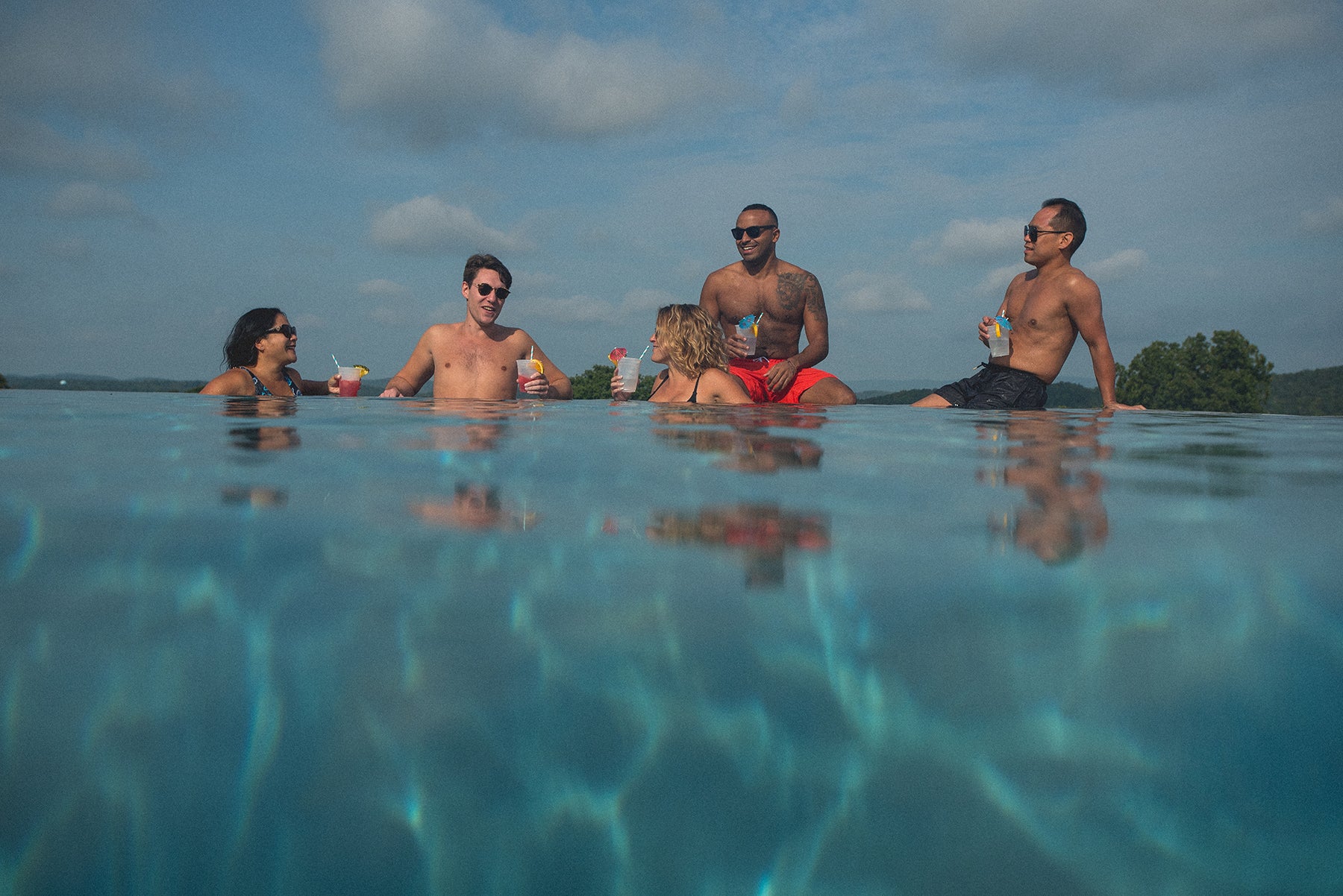 Friends together at an outdoor pool