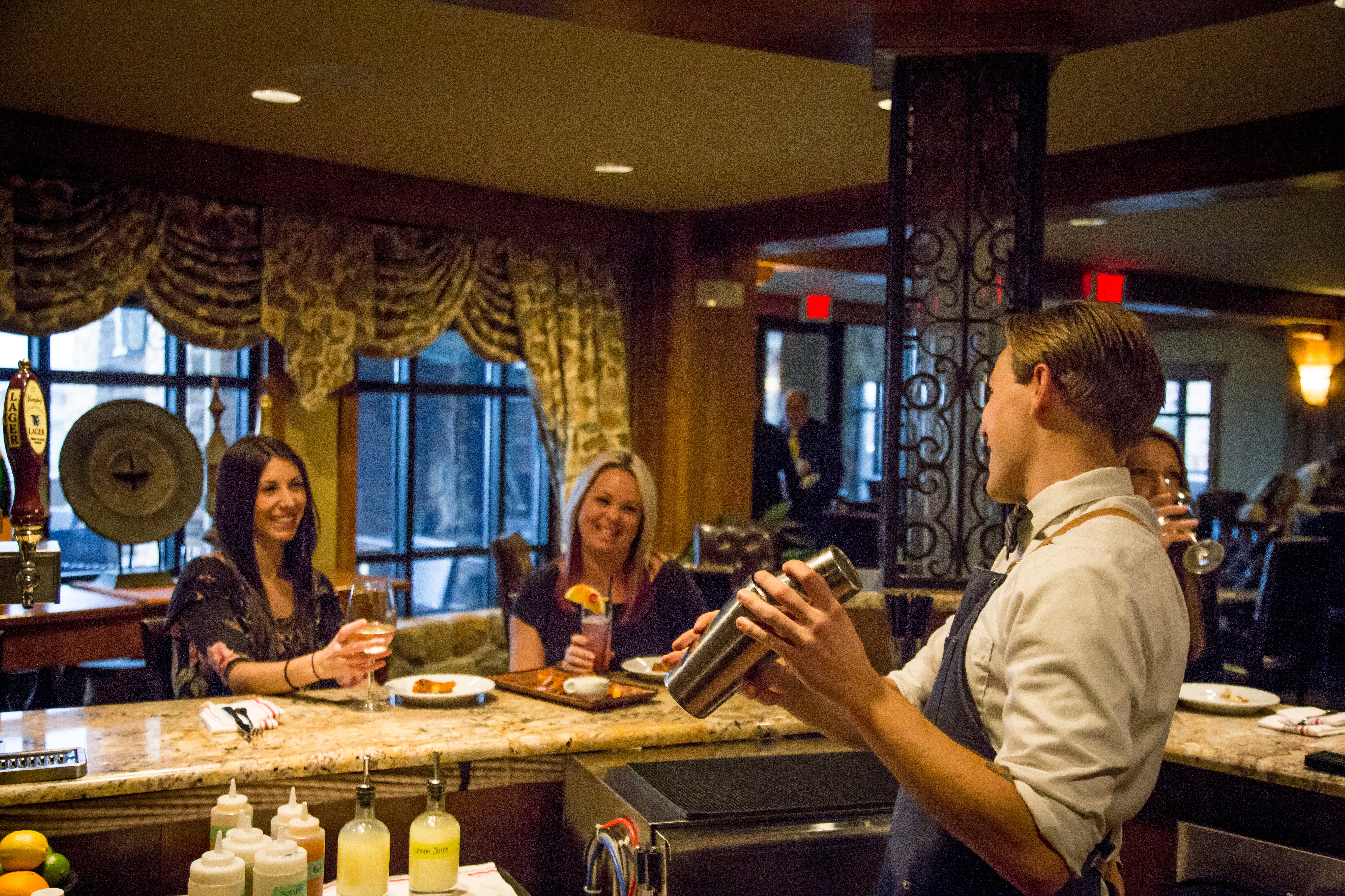 Bartender making cocktails at Springs Bistro