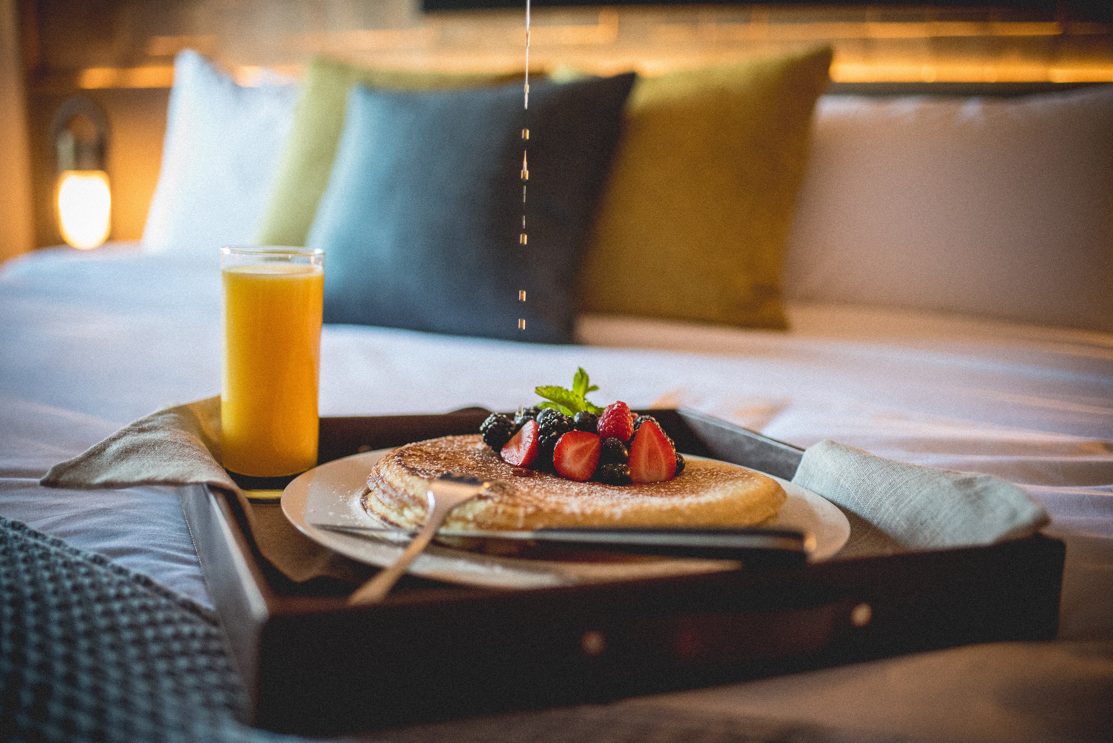 Berry pancakes with orange juice.