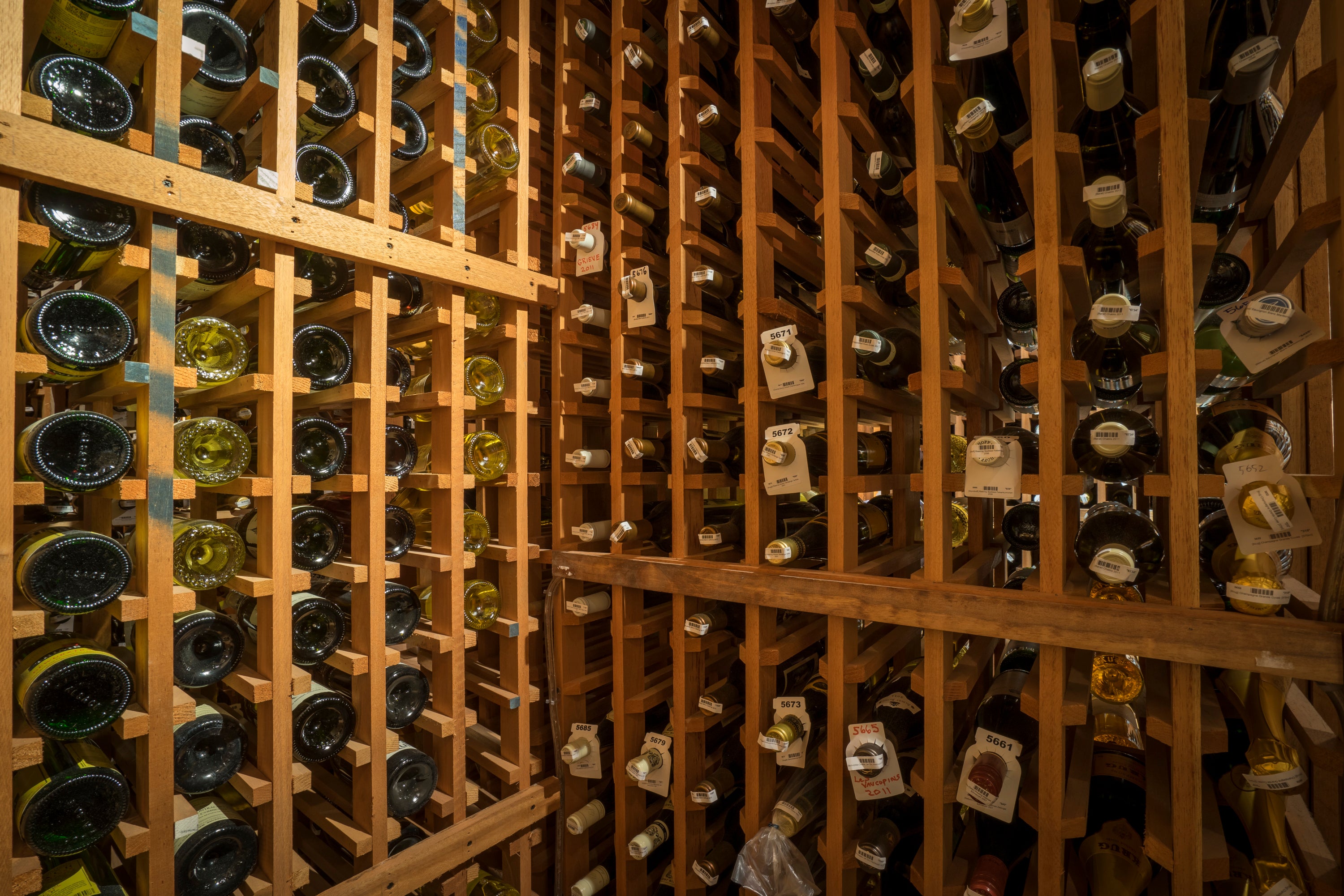 Wine bottles in wooden organizers.