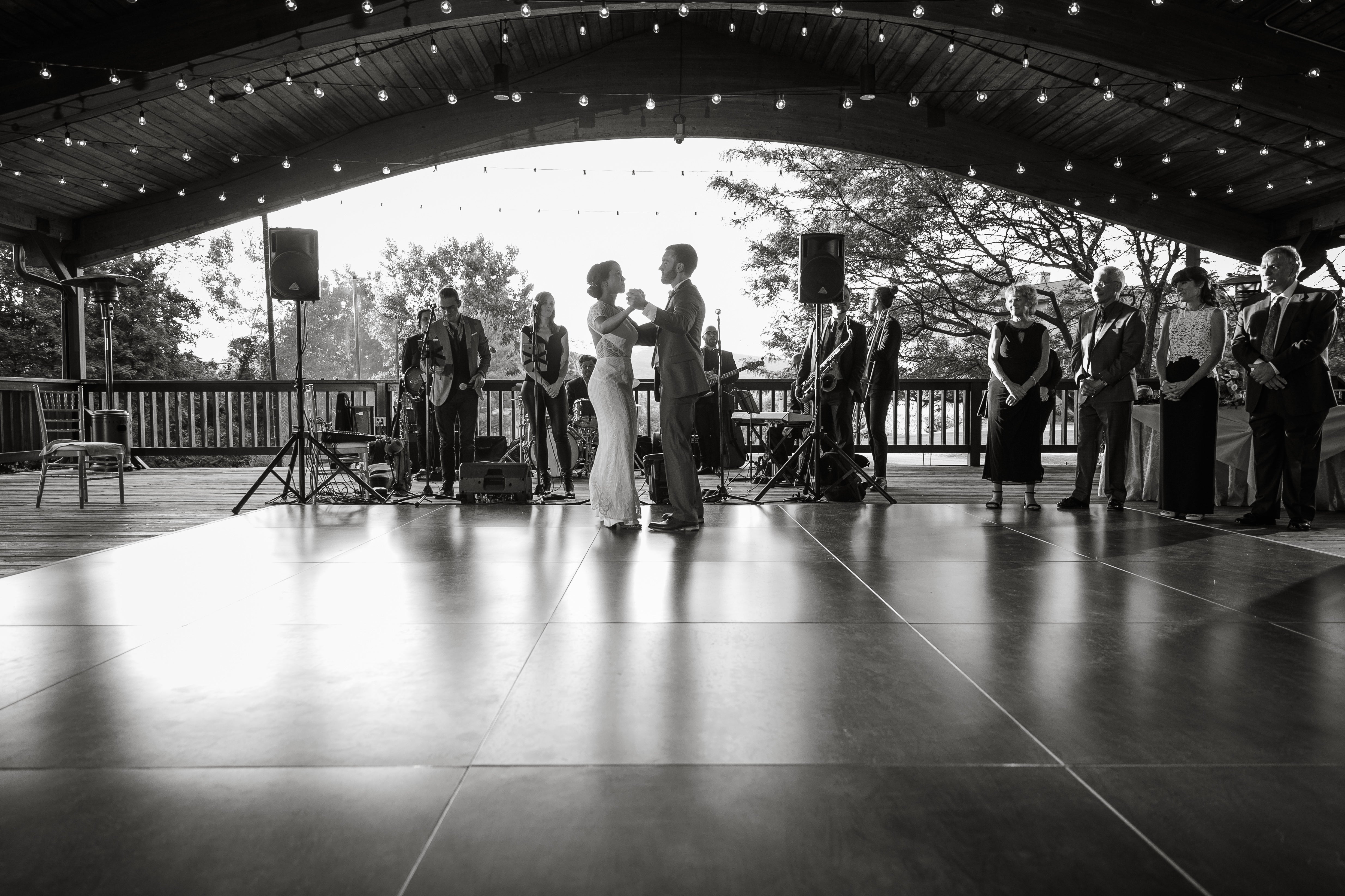 Bride and groom on dance floor in Sweetgrass Pavillion photo in black and white