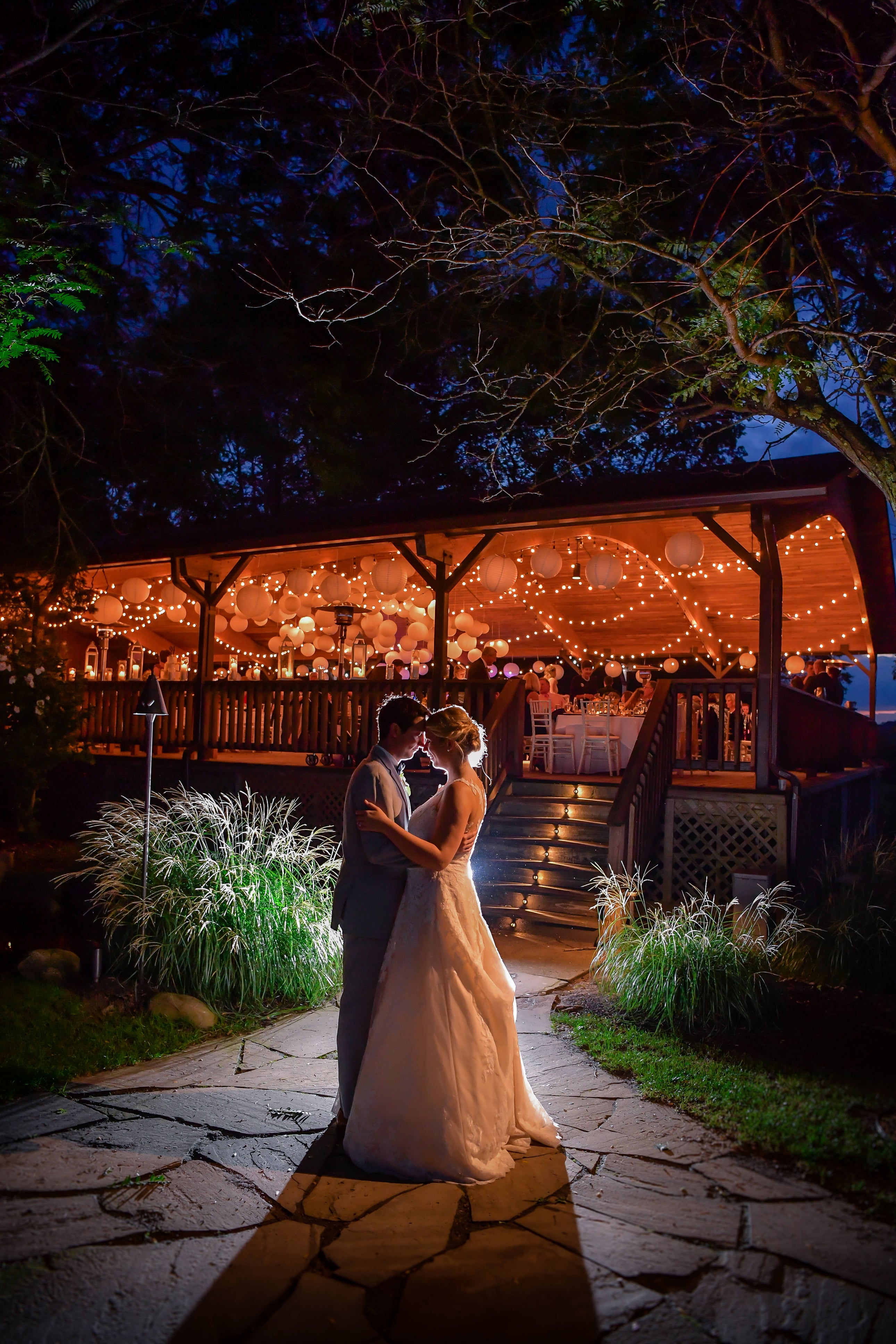 Romantic bride and groom outside of Sweetgrass Pavillion wedding reception