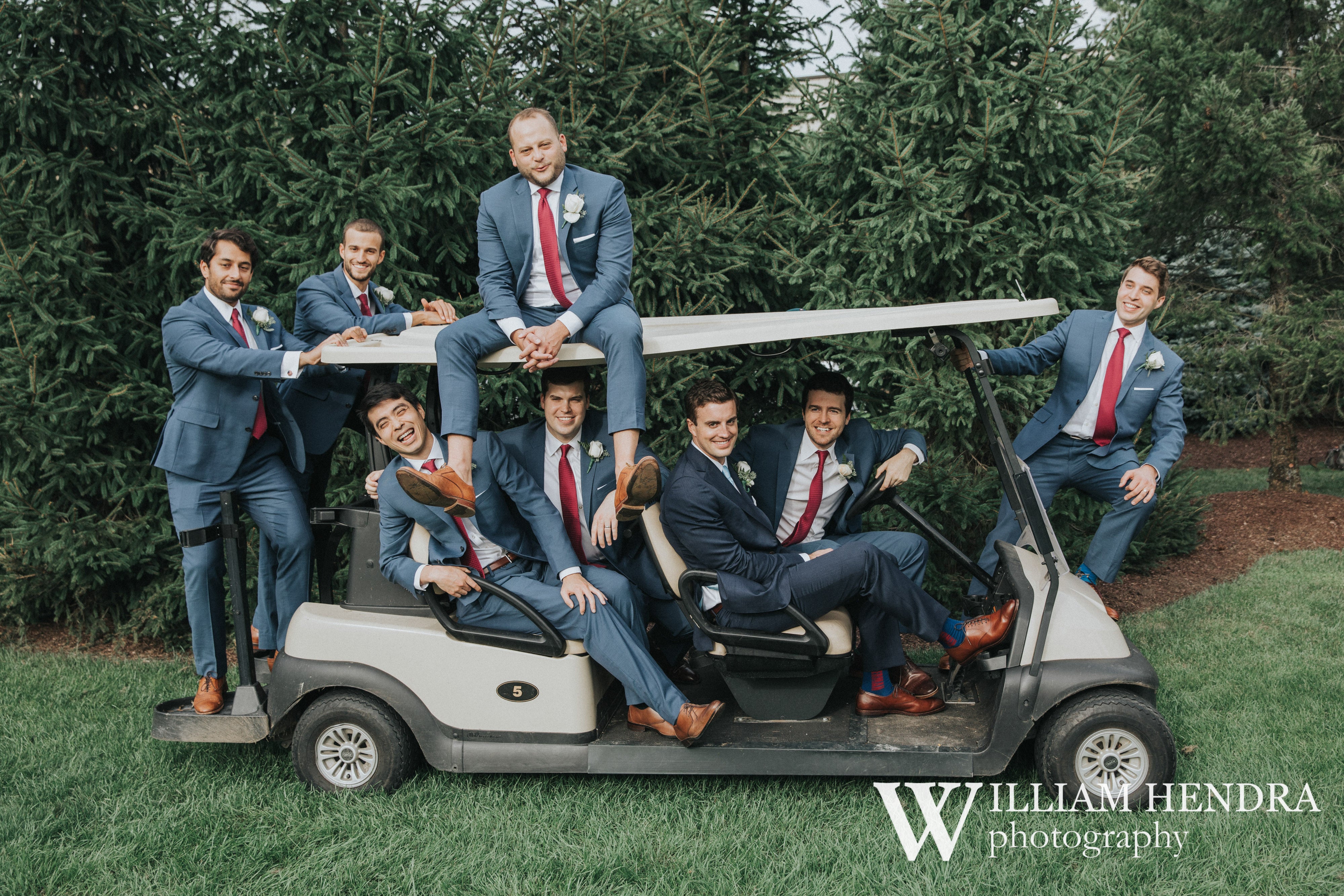 Groomsmen piled onto golf cart