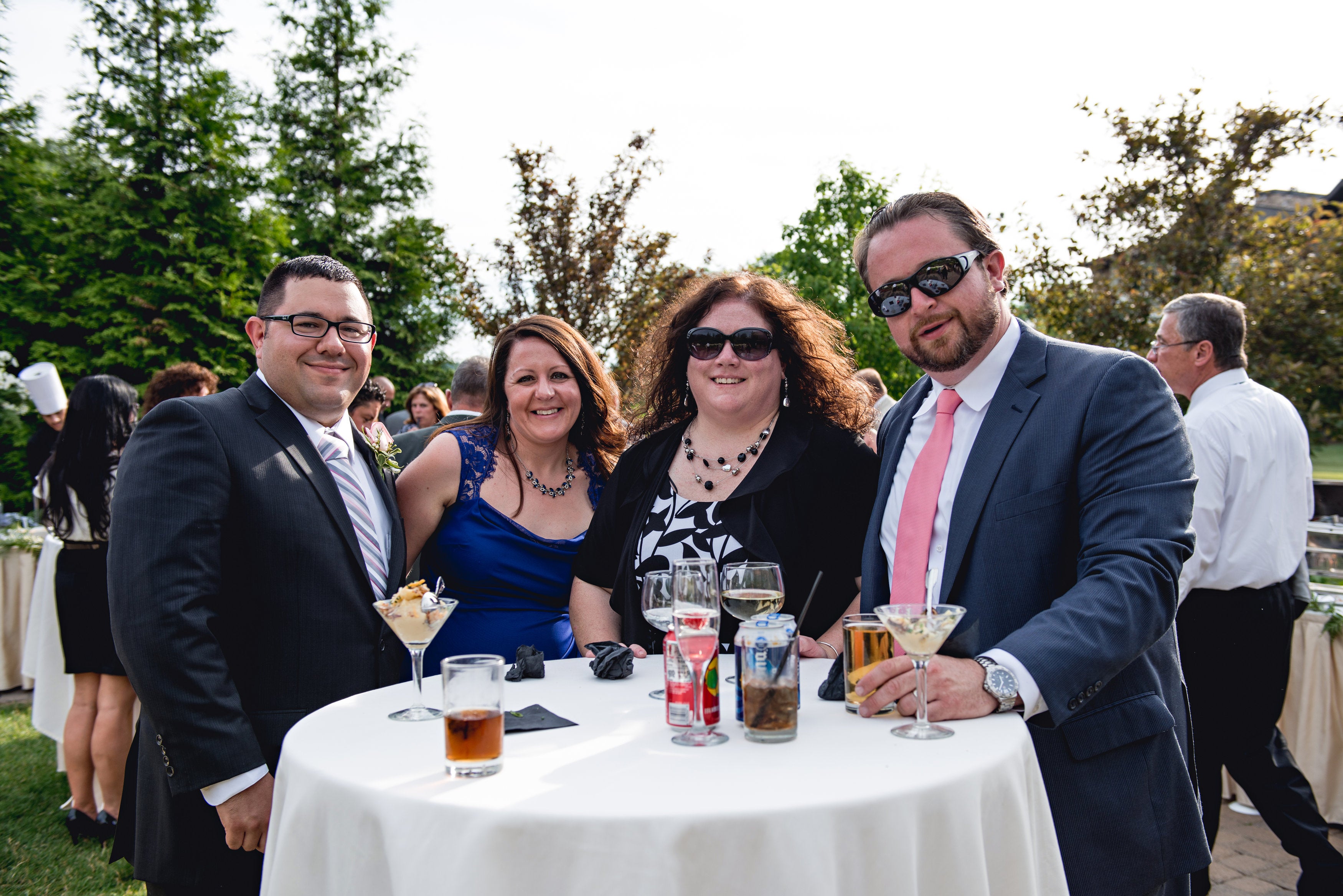 Group of people enjoying cocktail hour at wedding