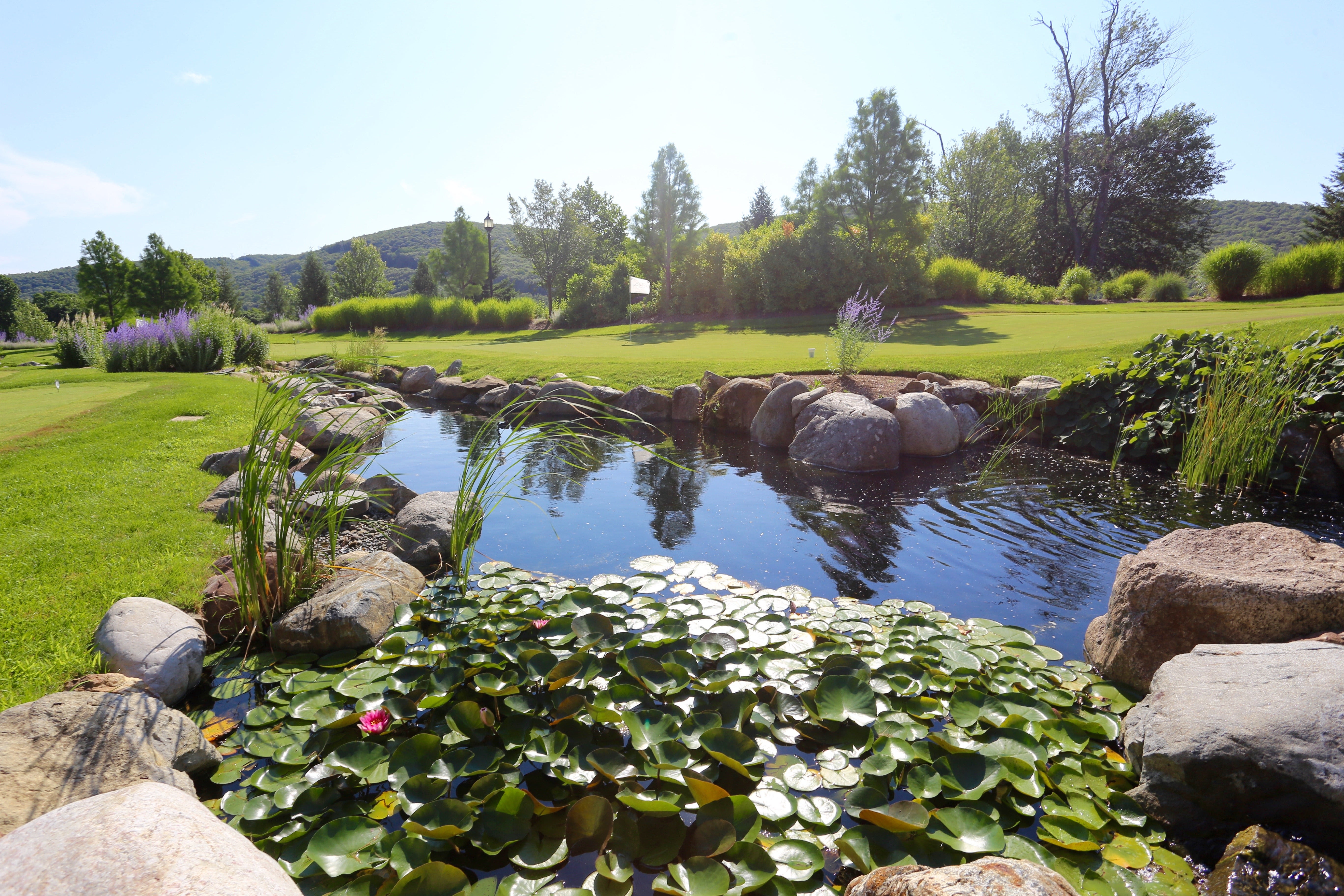 A water feature on the putting course at Grand Cascades Lodge