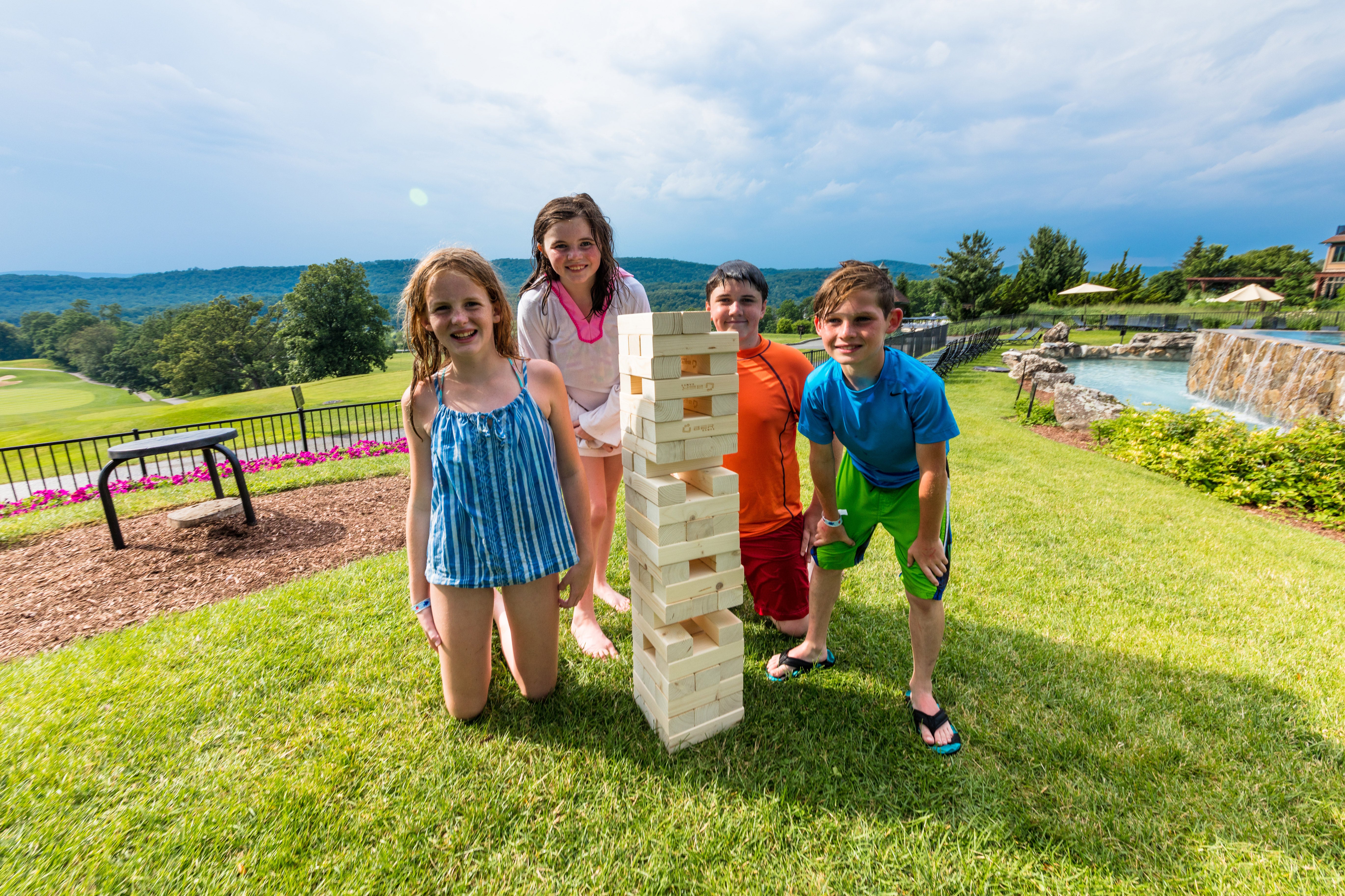 Kids playing lawn jenga.