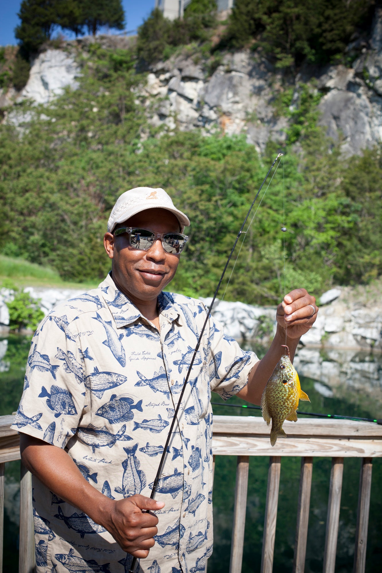 Man holding fish at the quarry