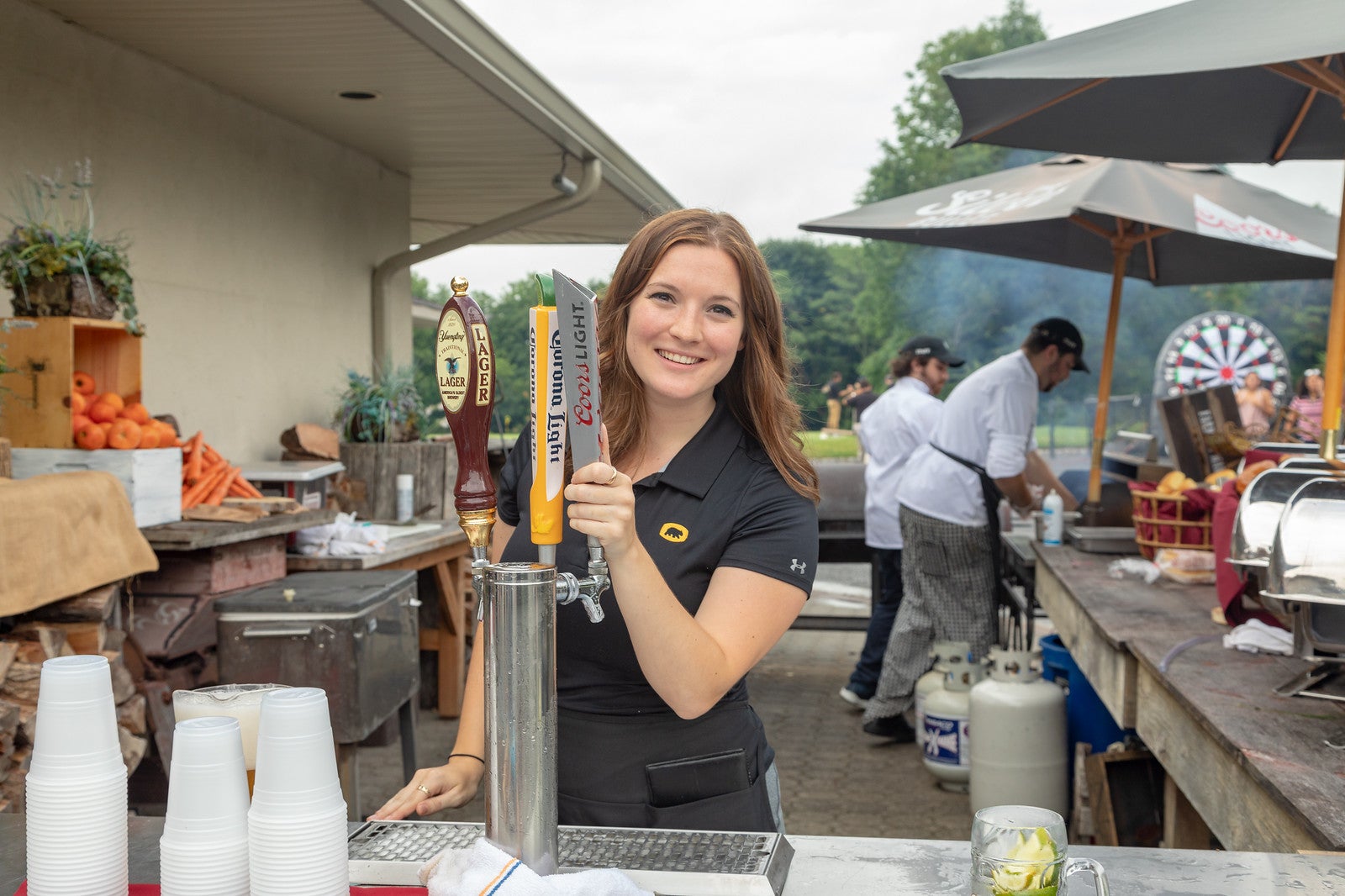 Server at Black Bear Golf Club serving beer
