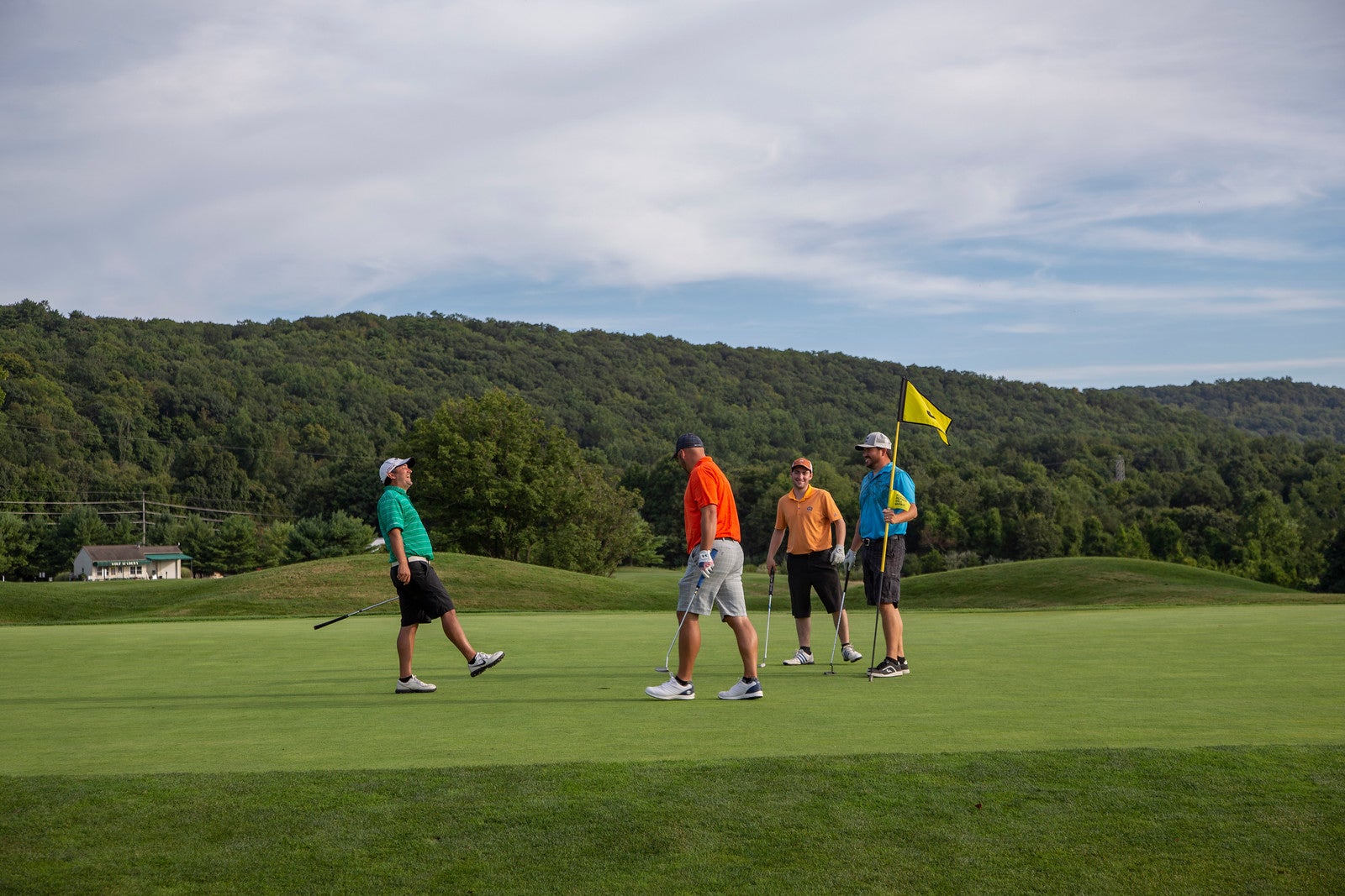 Foursome of guys on the green at Black Bear Golf Club