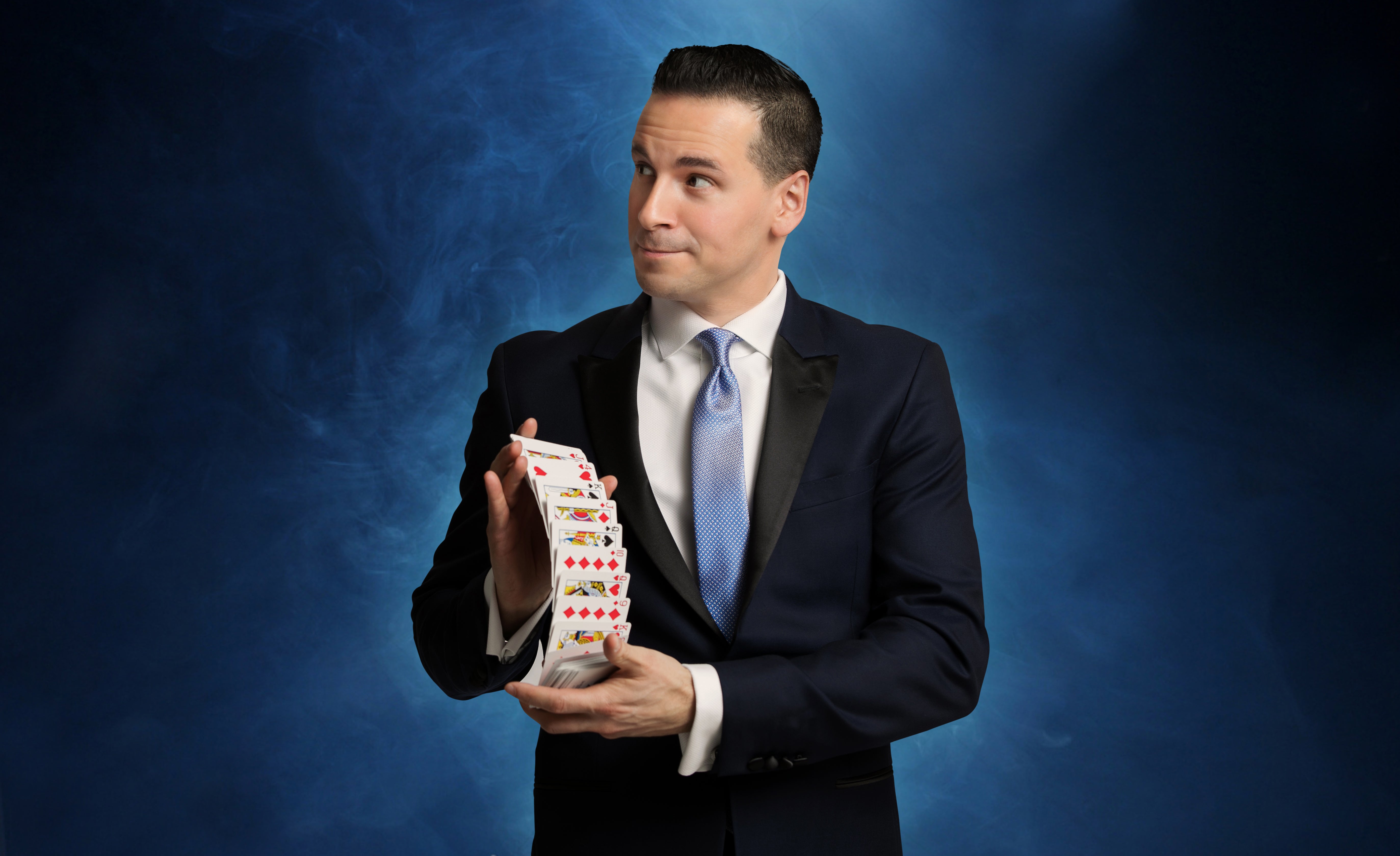 Tom Pesce shuffling deck of cards.