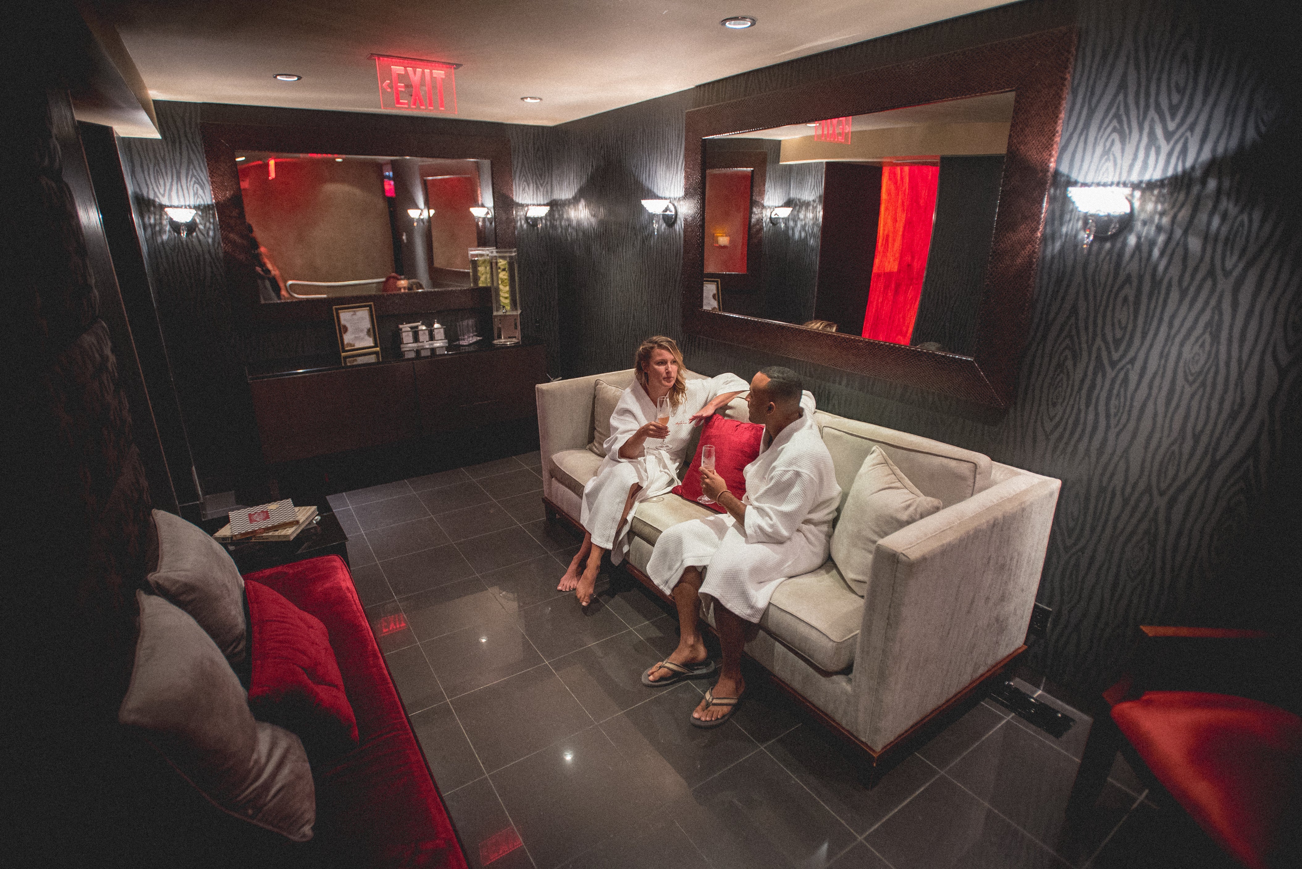 Man and woman in Reflections Spa lounge.