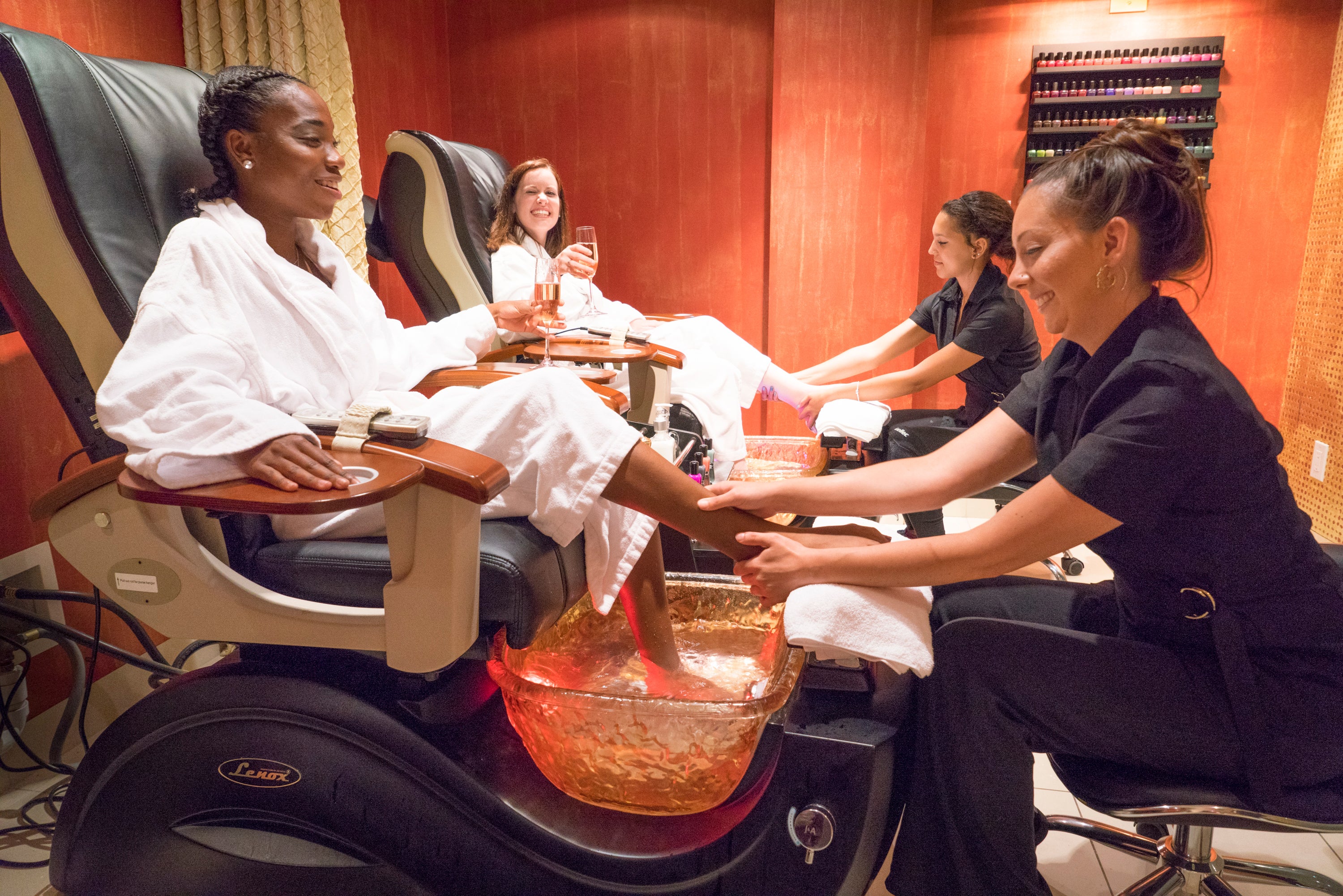 Two guests in white robes getting a pedicure at Reflection Spa in NJ.