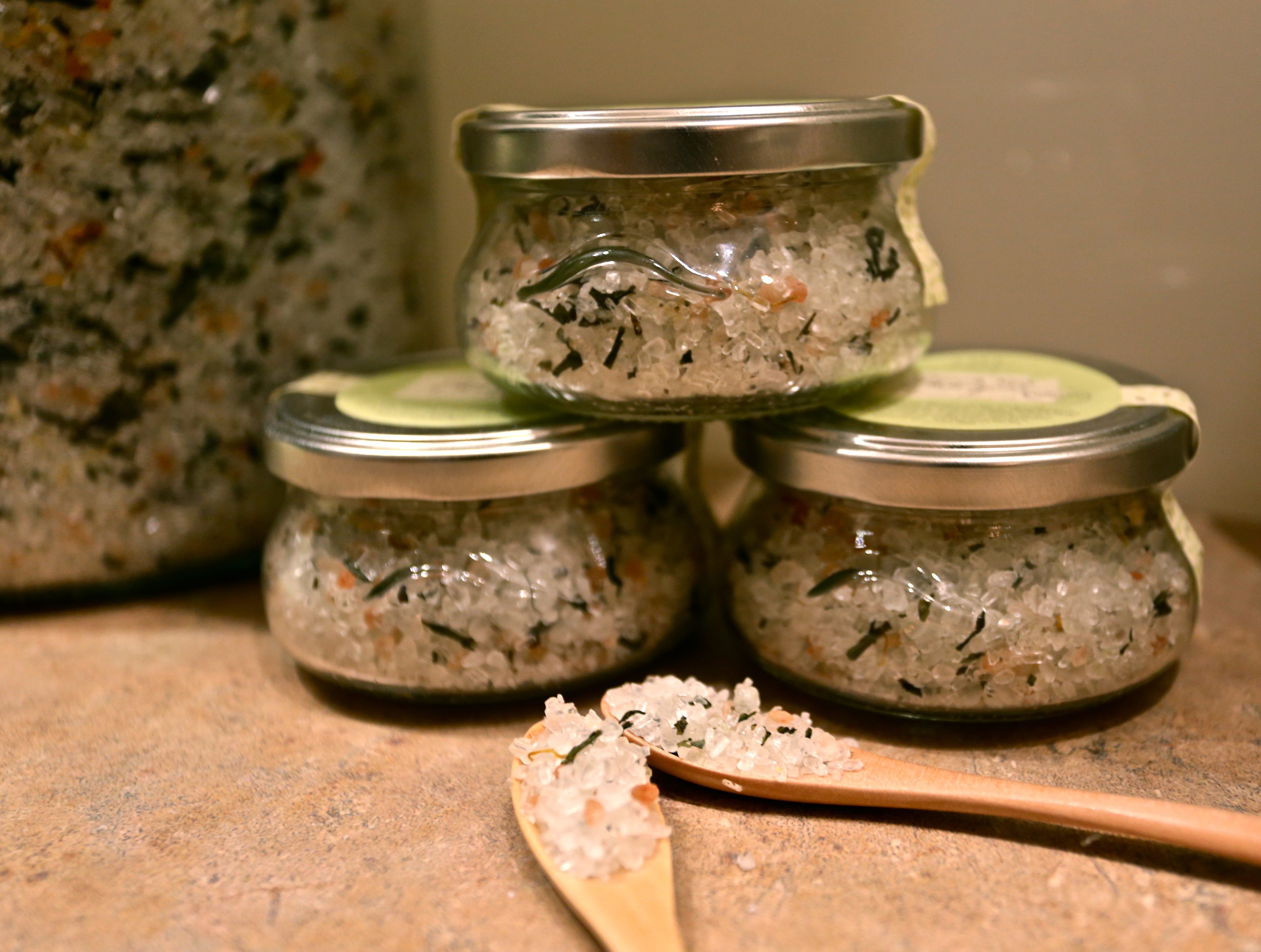 Glass body scrub containers with scrub within.