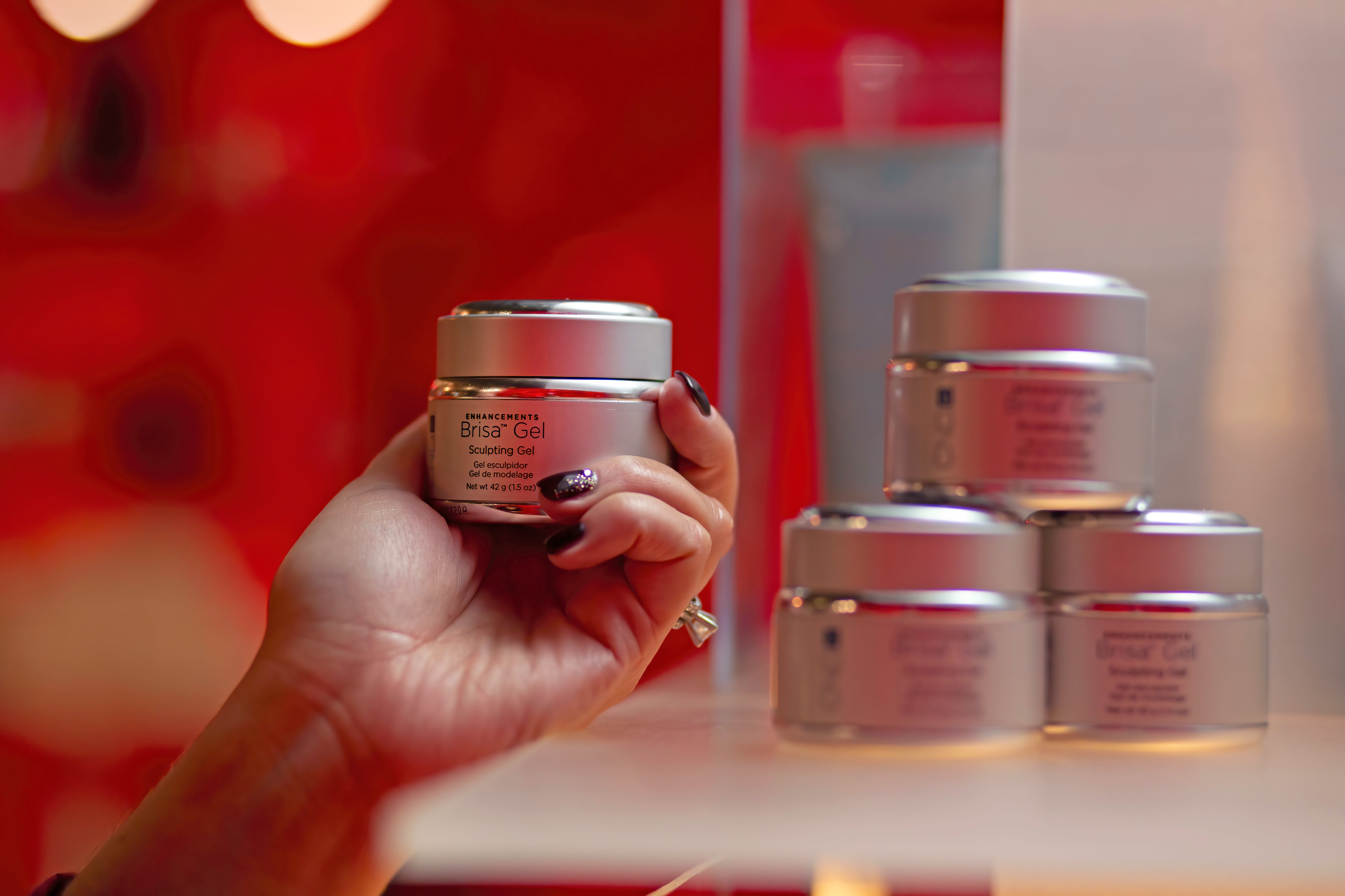 Hand holding Brisa gel polish.