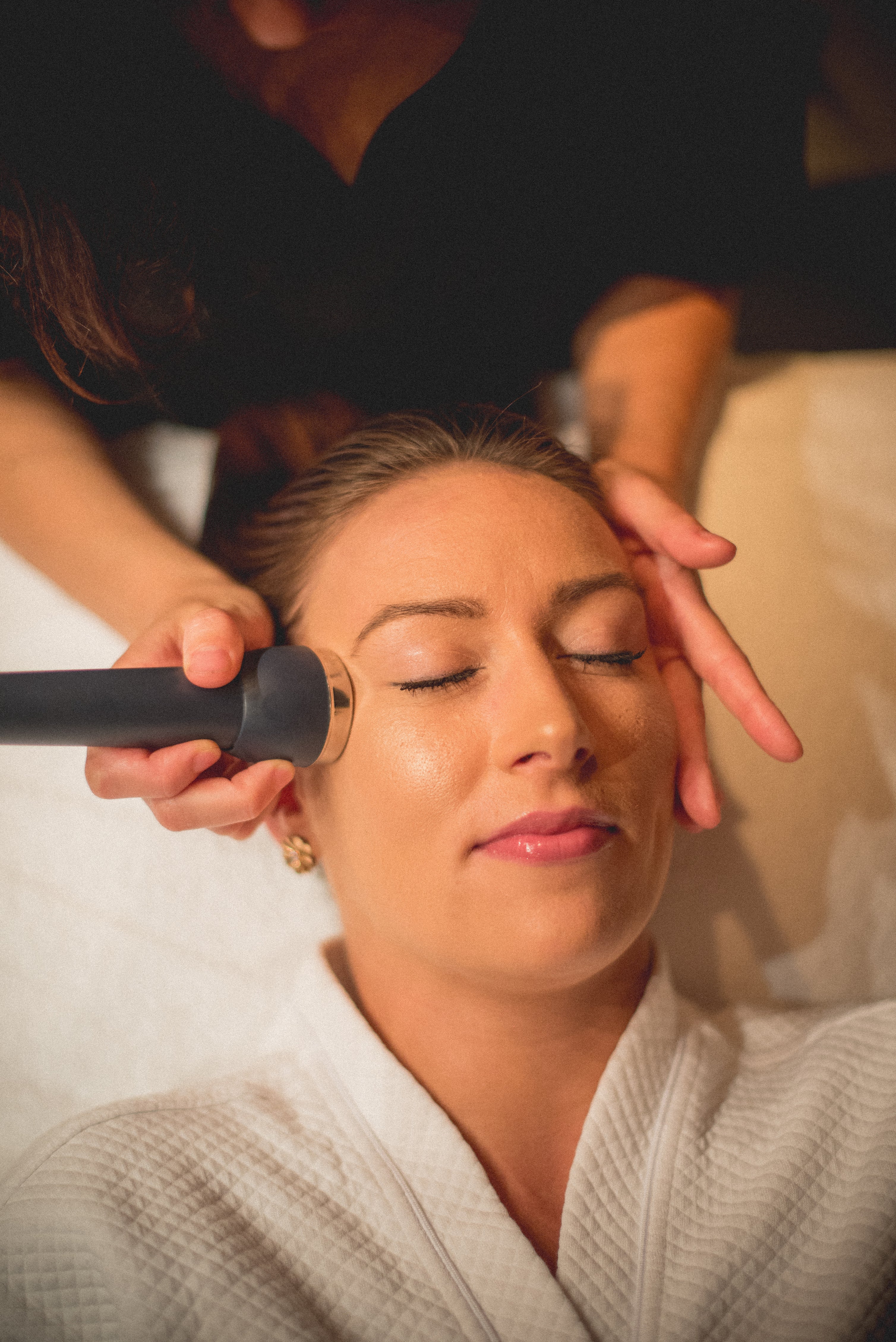 Woman receiving a facial at Reflections Spa