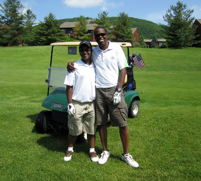 Father and son on a golf course a Crystal Springs Resort