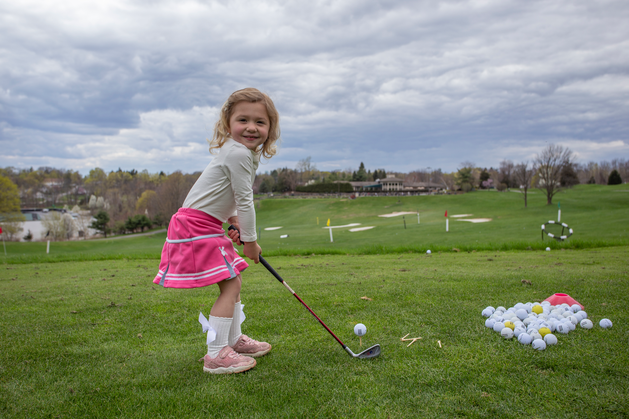 Young girl learning to golf at Crystal Springs Resort