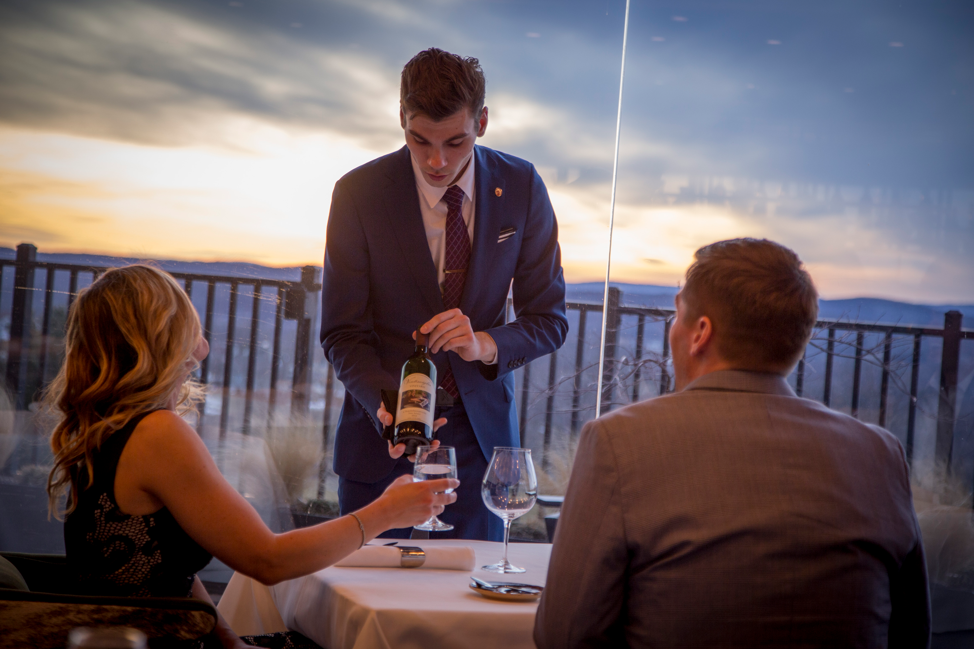 Sommelier serving wine