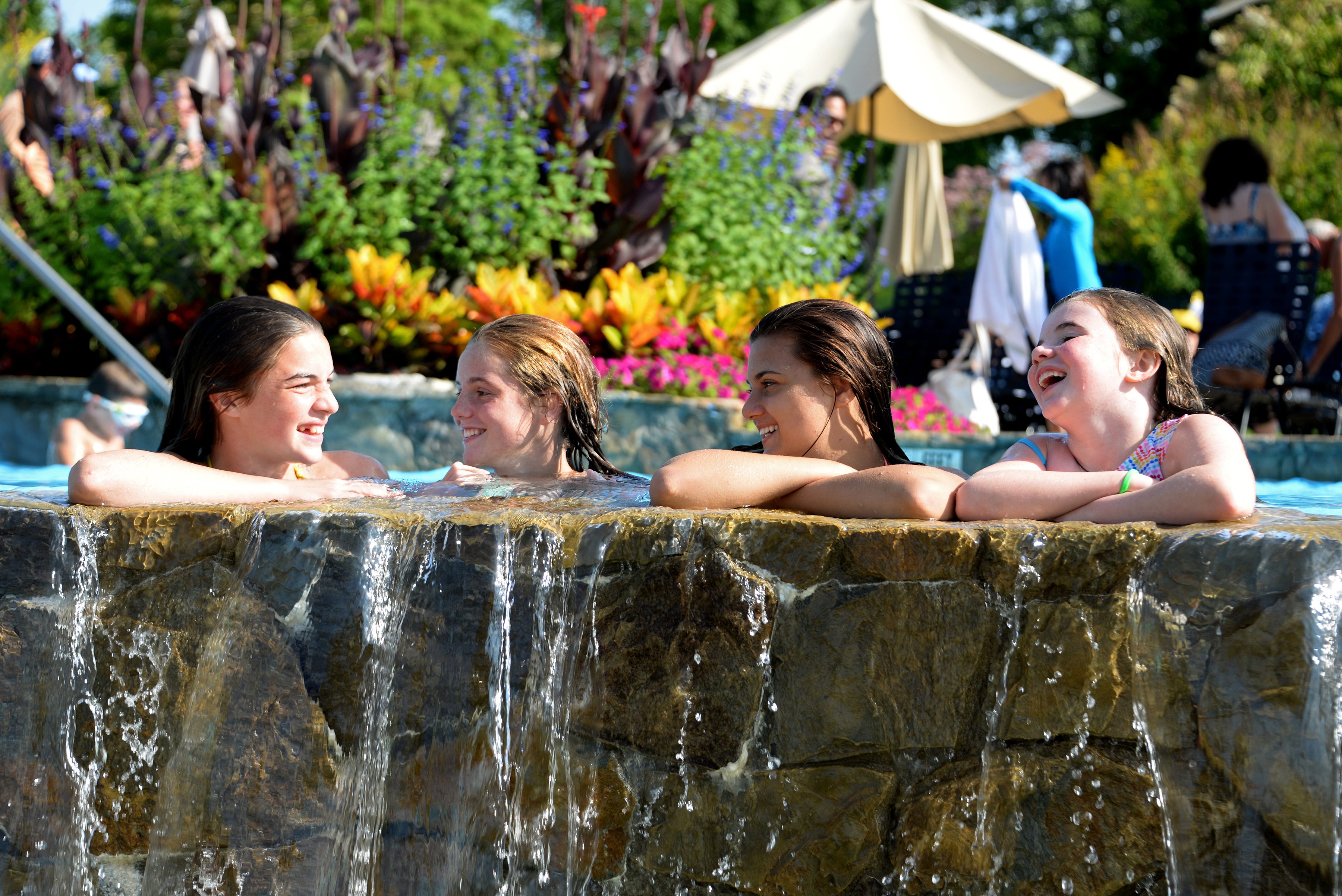 Children laughing while they swim in Vista 180 pool.