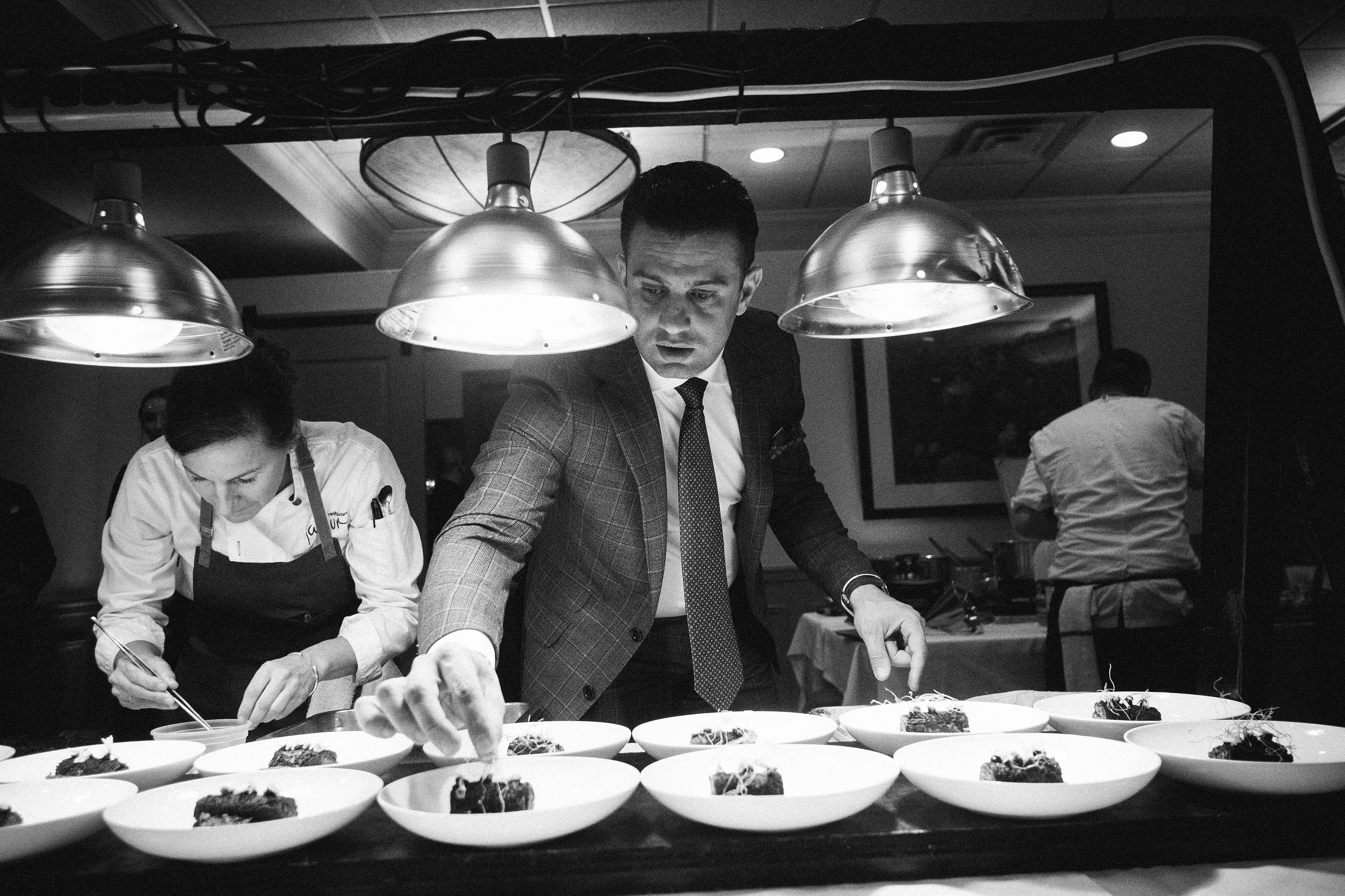 Robby Younes plating dinner