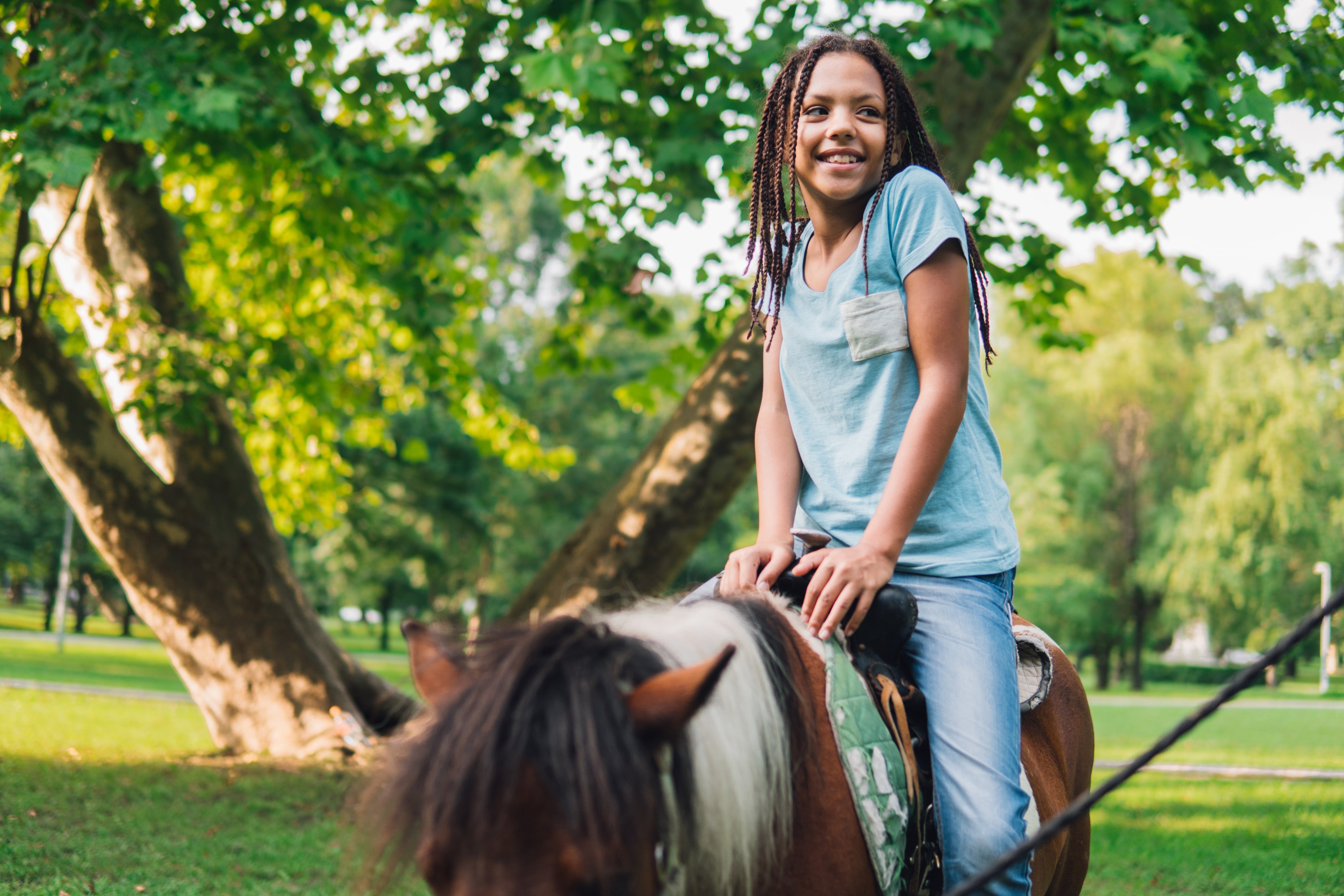 Young Girl Horseback Riding