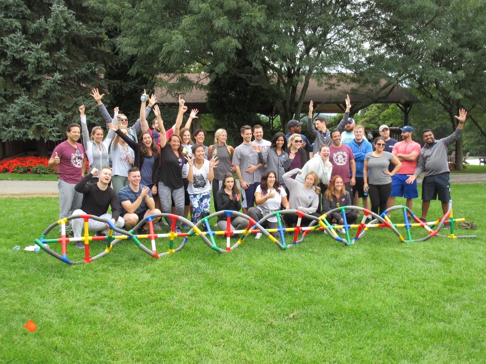 A group posing together after a teambuilding activity at Crystal Springs Resort