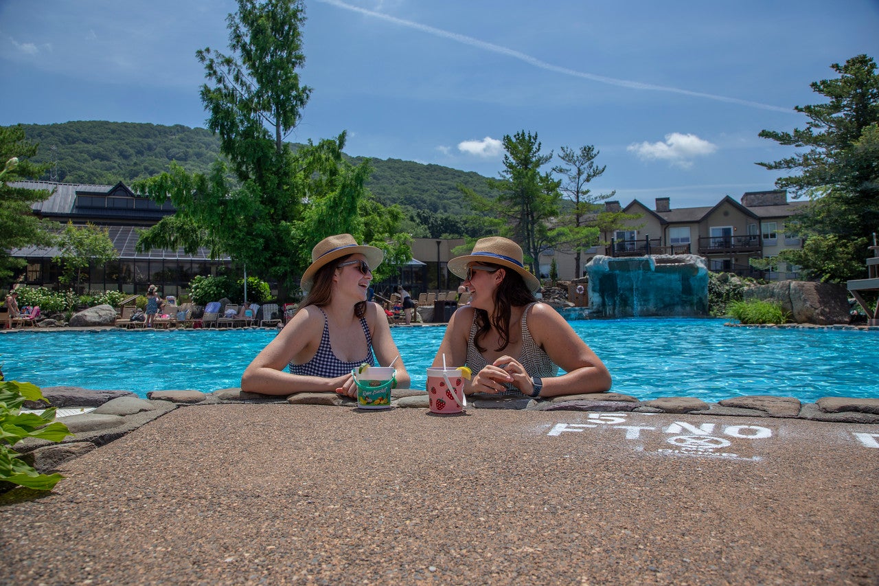 Girlfriends enjoying rum buckets at Minerals Pool