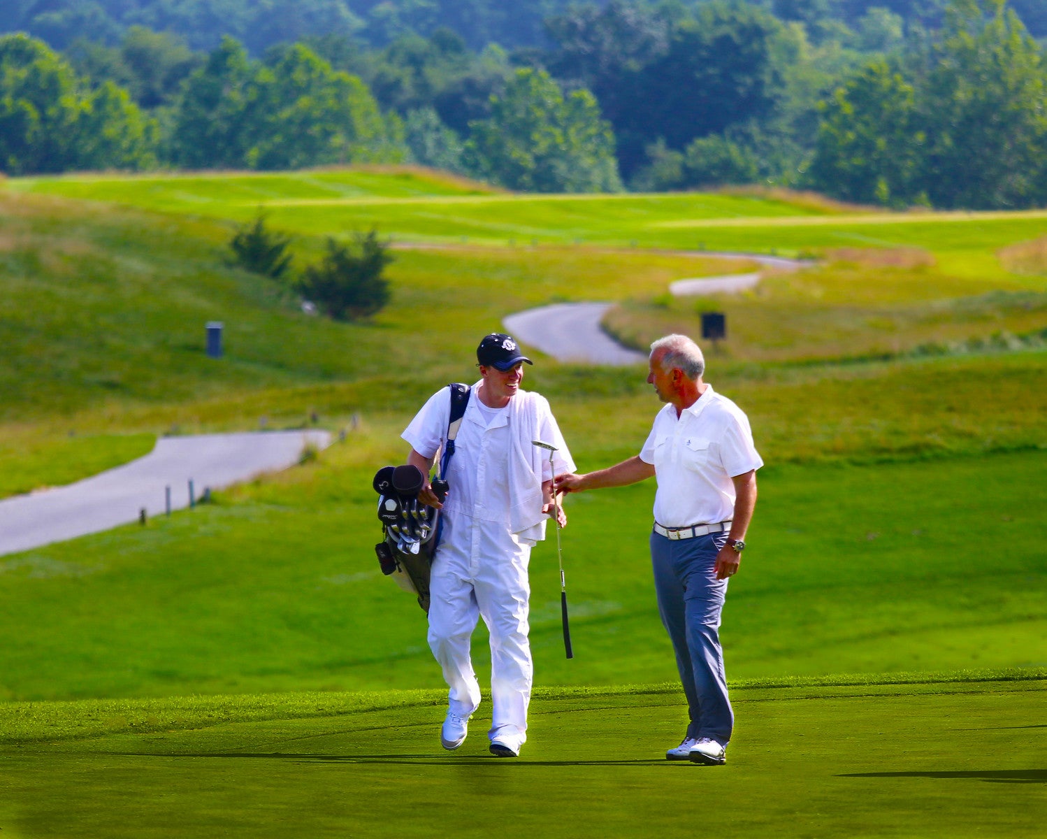 Golfer and Caddy on the course of Ballyowen at Crystal Springs Resort