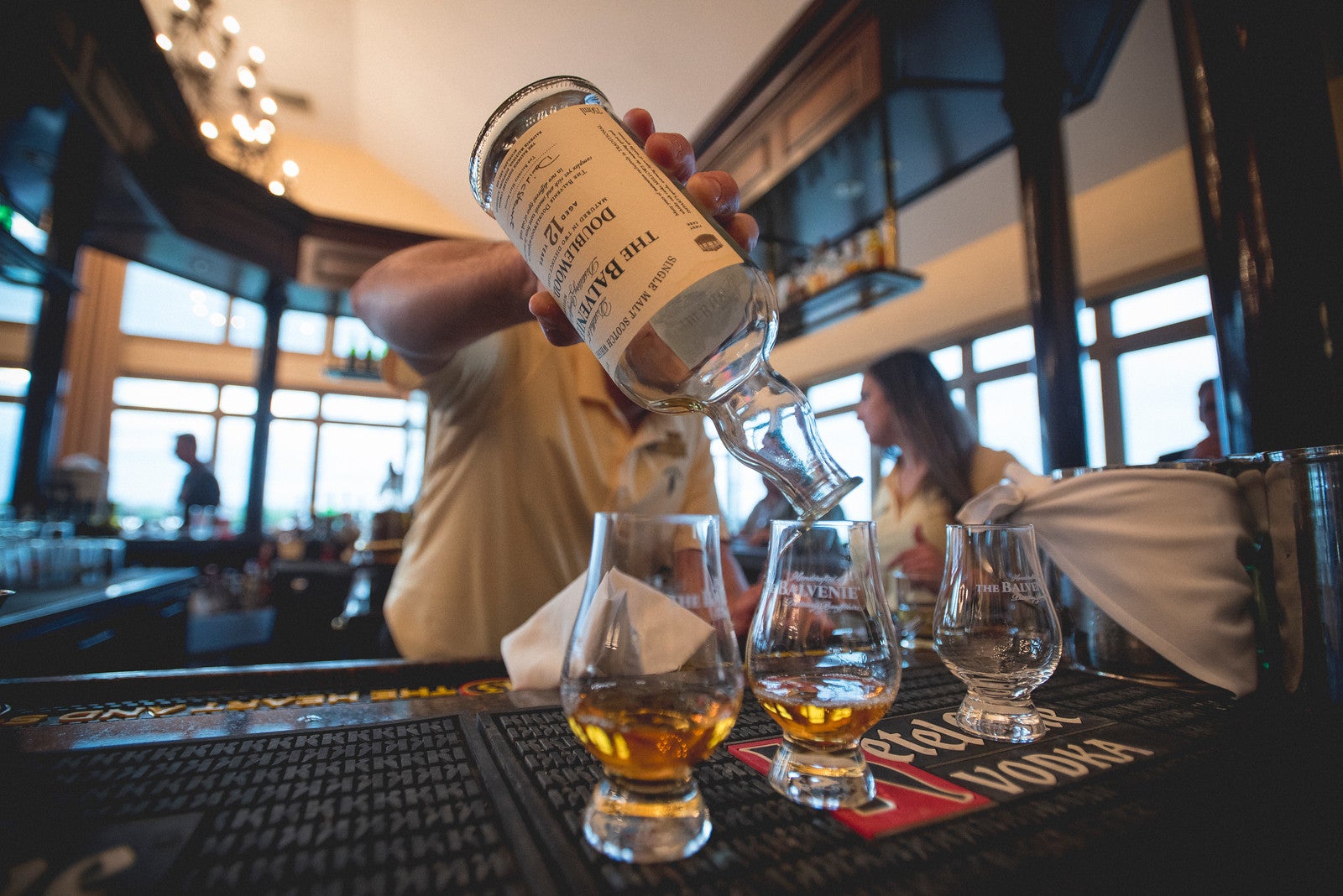 Bartender pouring whiskey at Owen's Pub