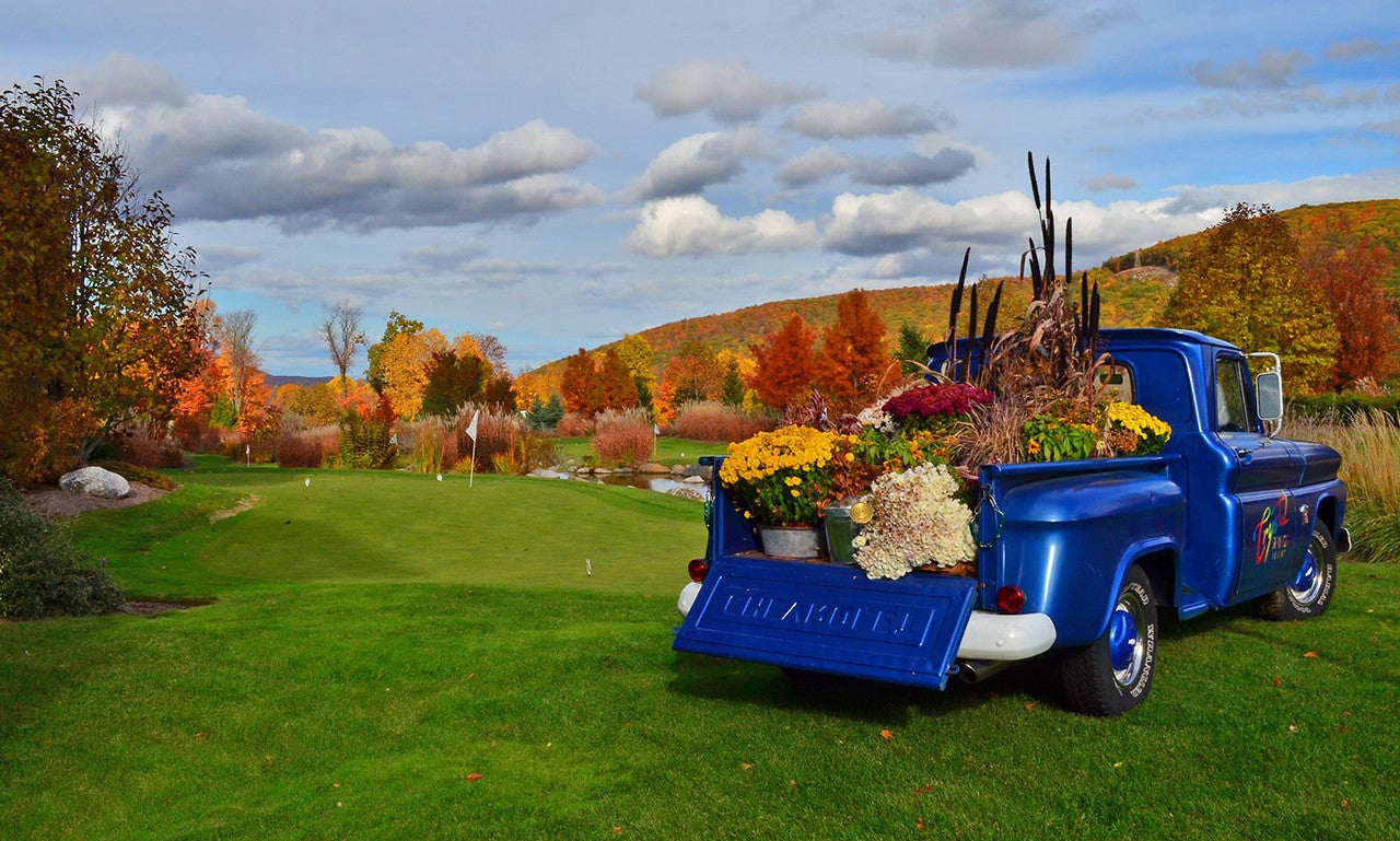 Blue Crystal Springs Resort truck filled with fall flowers