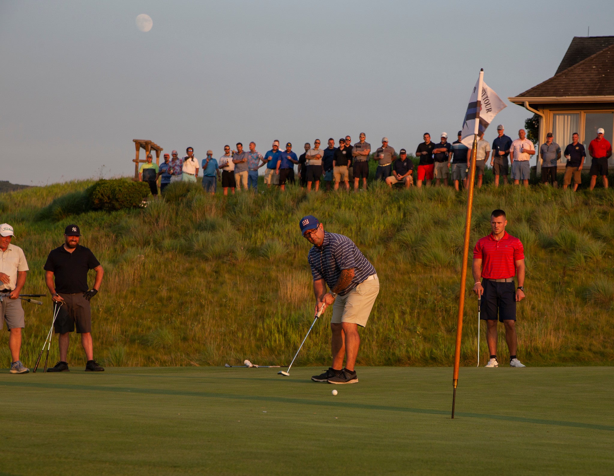 Spectators at the 2021 Law Enforcement Open watching golfer