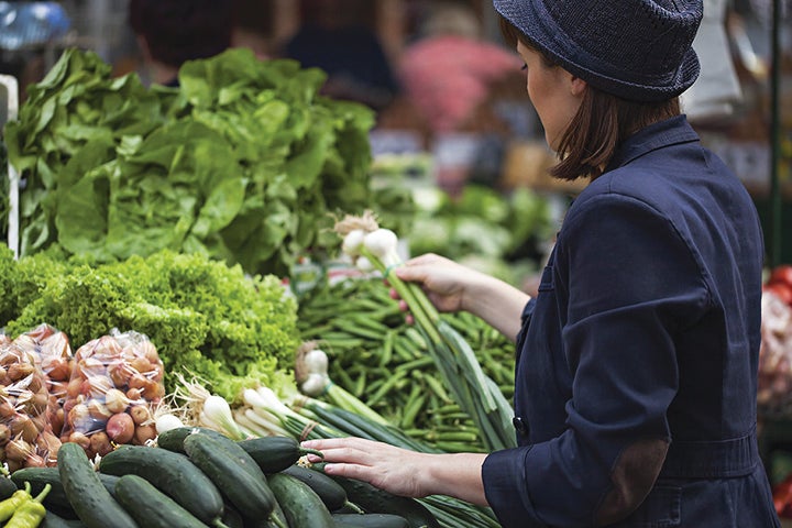 Women shopping for fresh vegetables at farmer's market