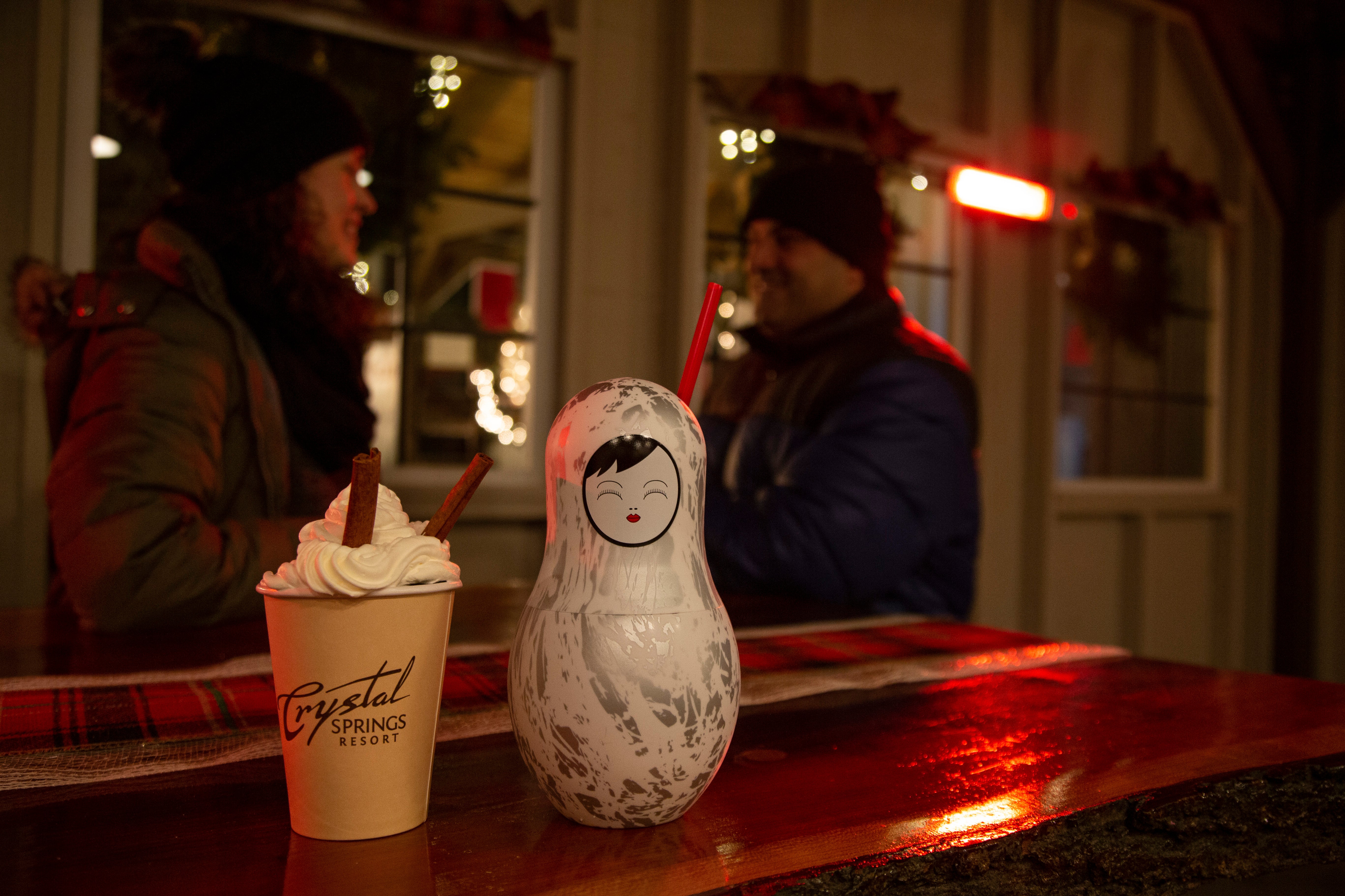 Couple sitting at Frosty's Cantina enjoying hot chocolate.