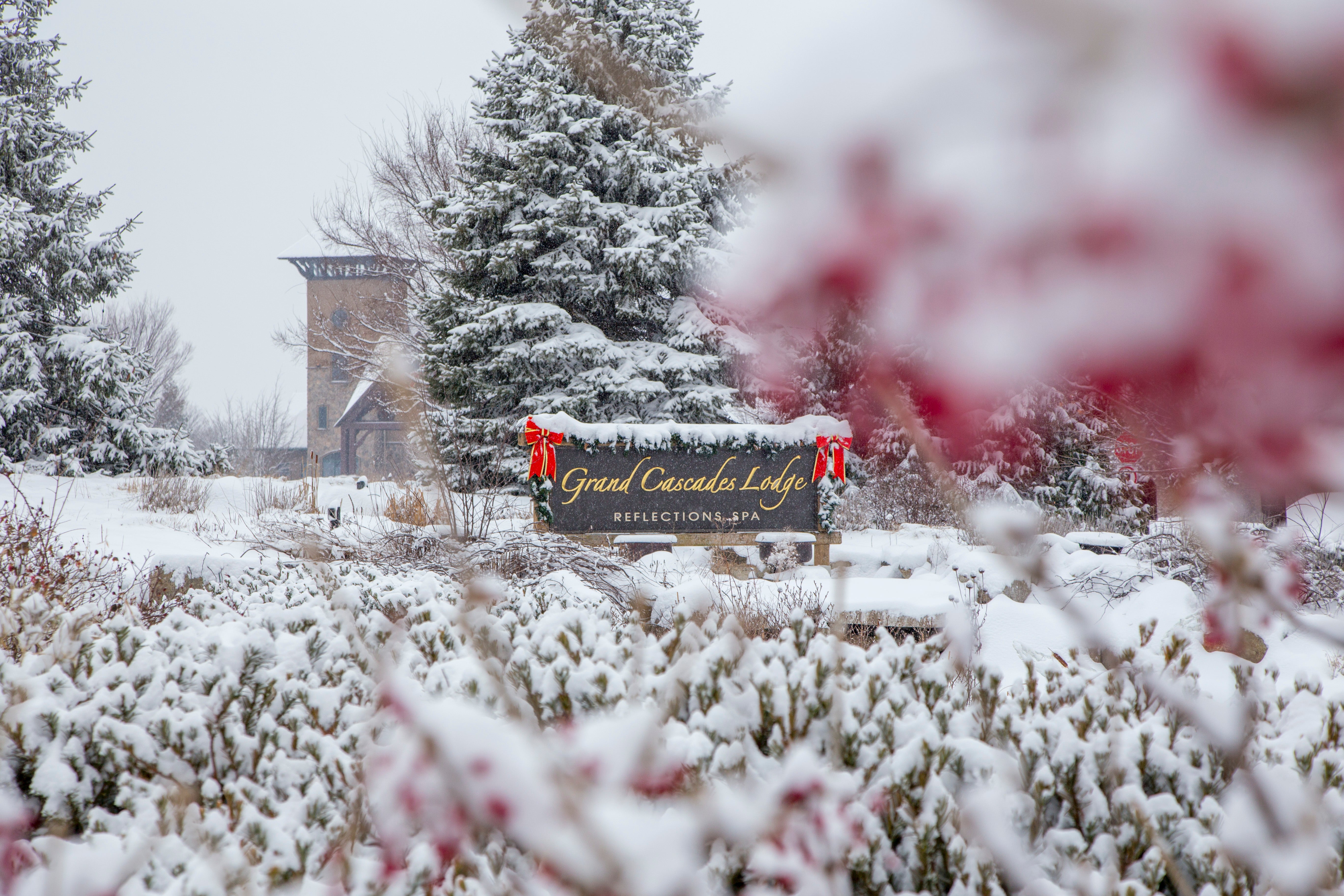 Grand Cascades Lodge entrance sign during the winter season