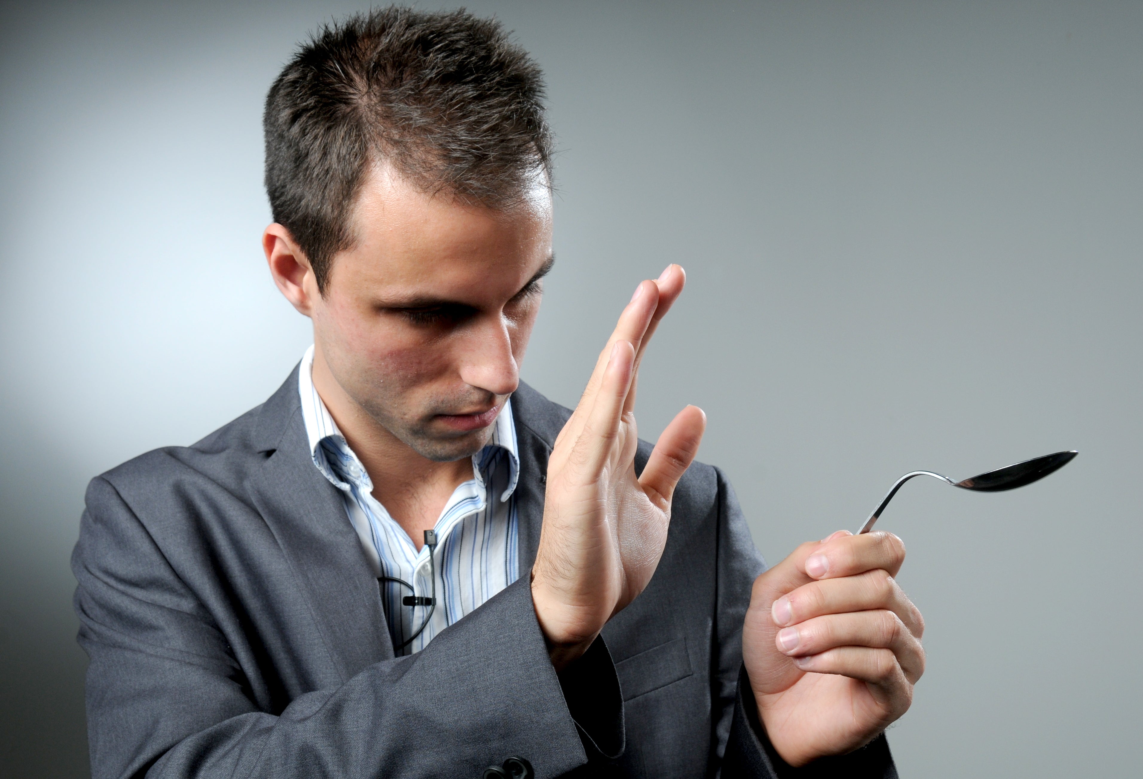 Jesse Dameron holding a bent spoon.