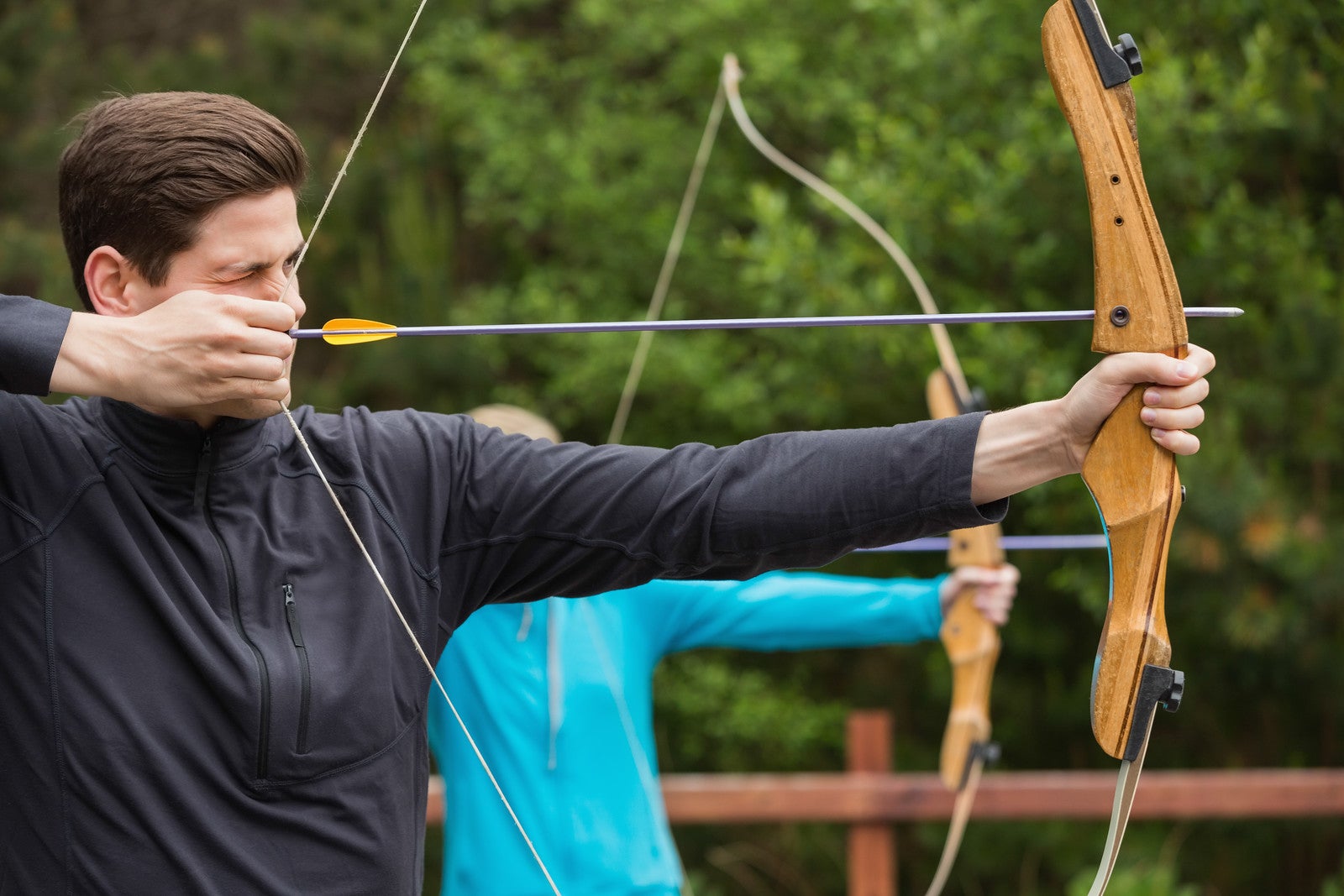 Male practicing archery. 