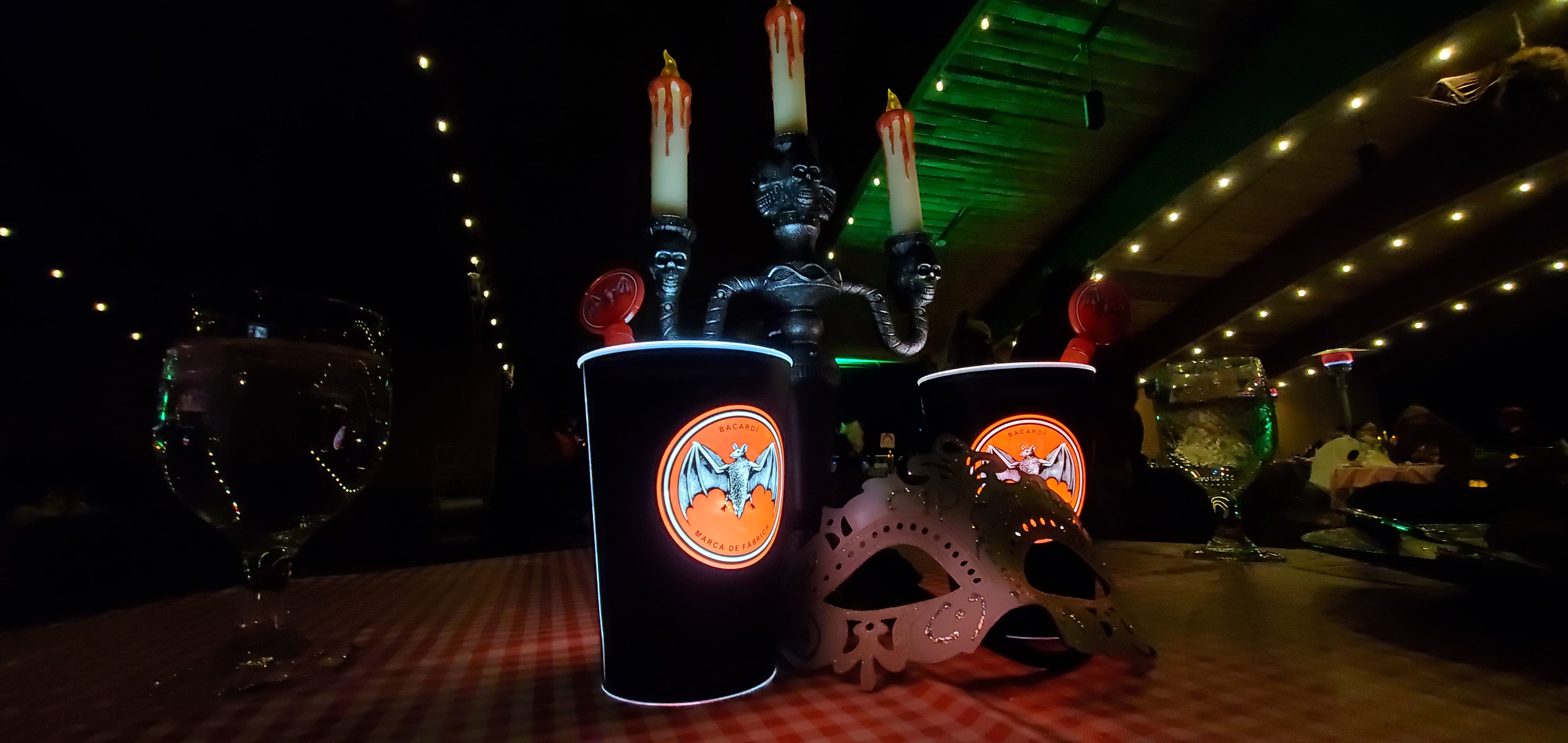 Black cup with bat on it.