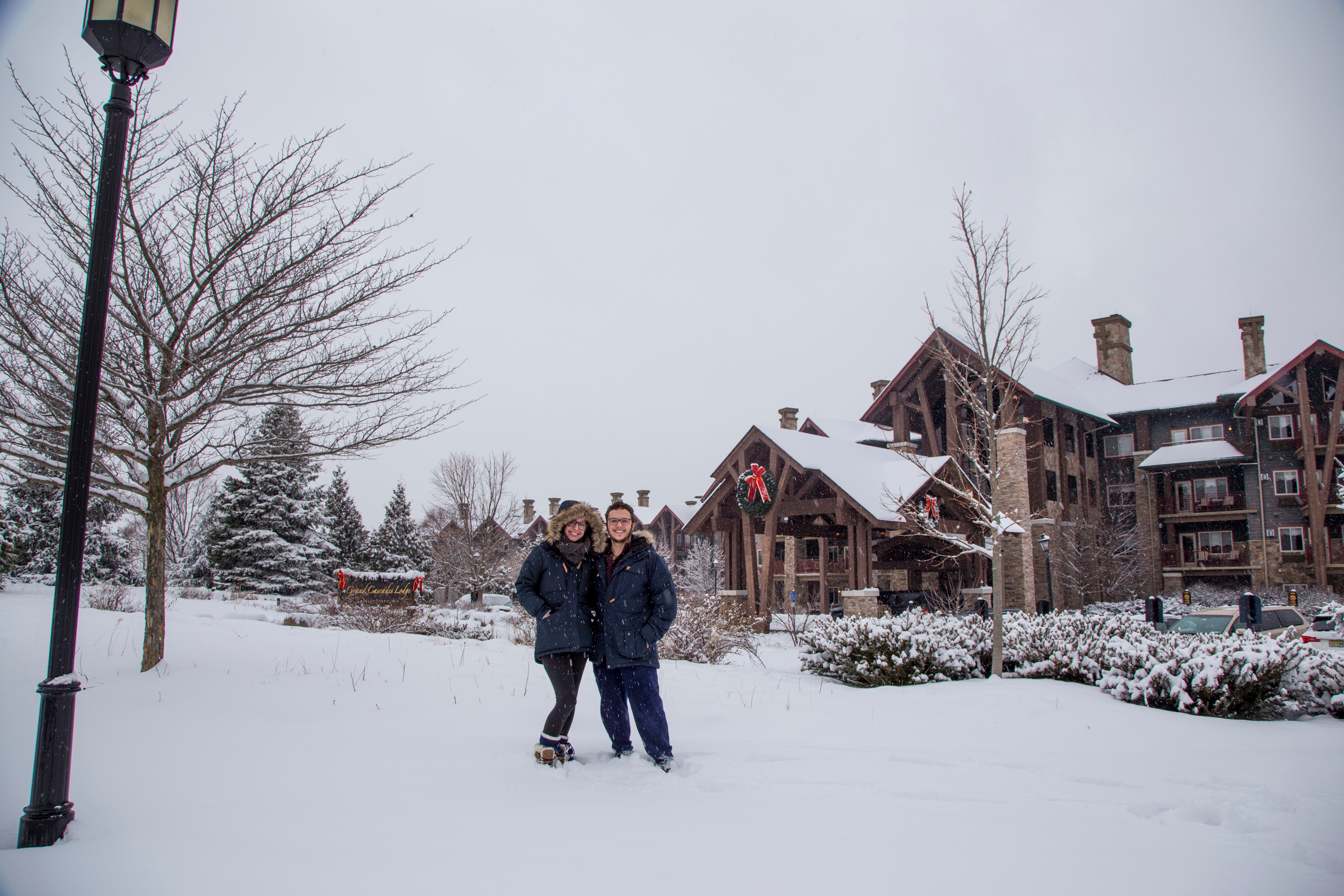 Couple on a snowy day at Grand Cascades Lodge