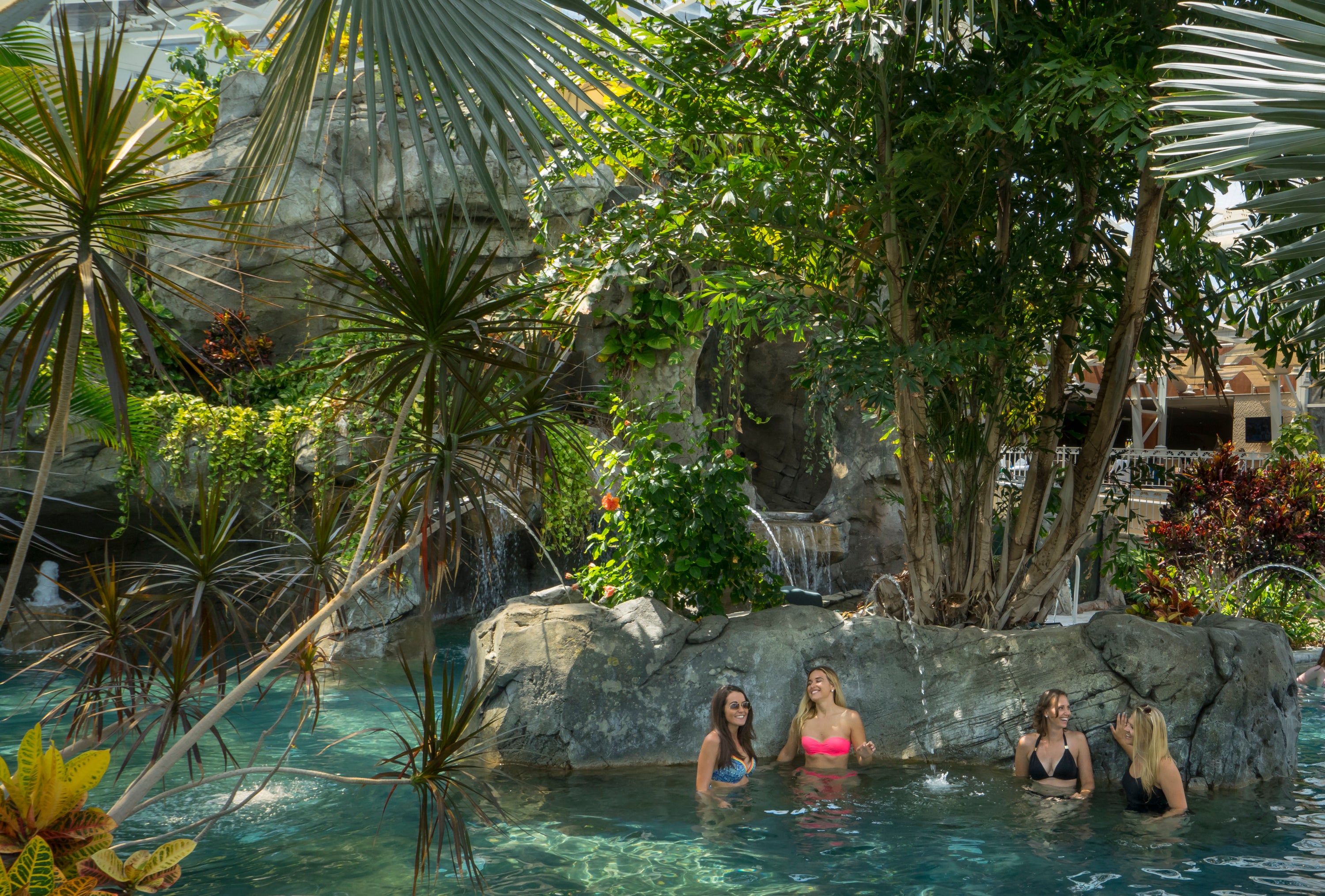 Four girlfriends hanging out in Bioshpere pool