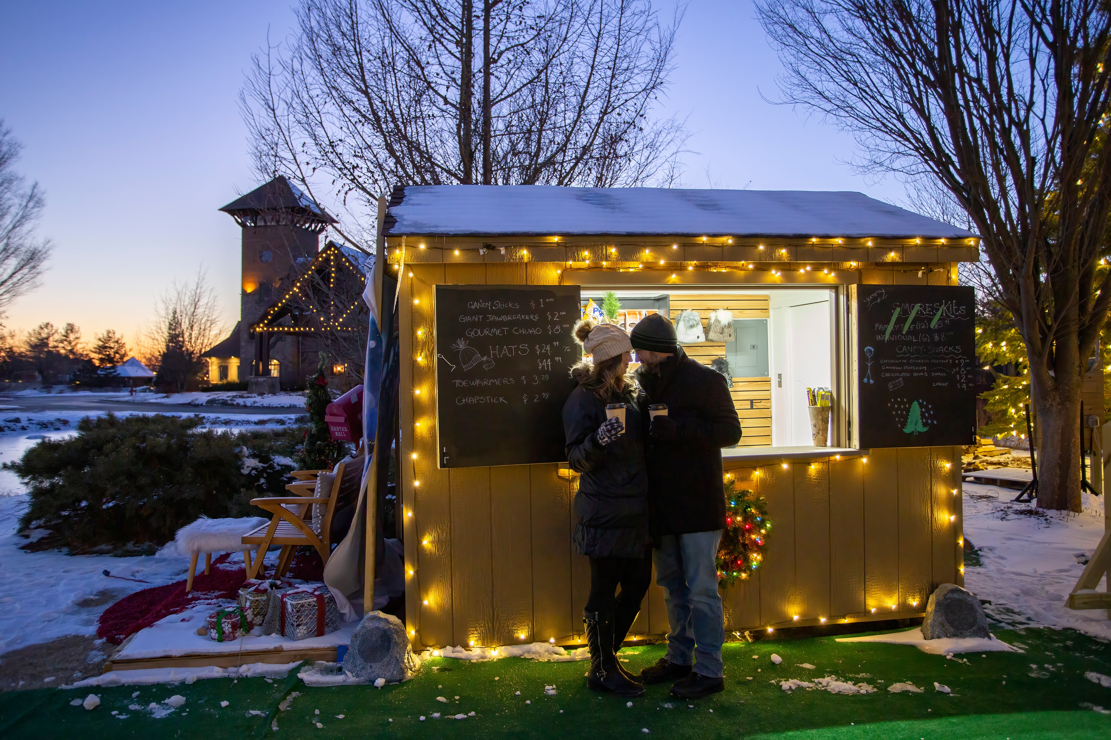 Couple standing in front of Schnapps Shack.