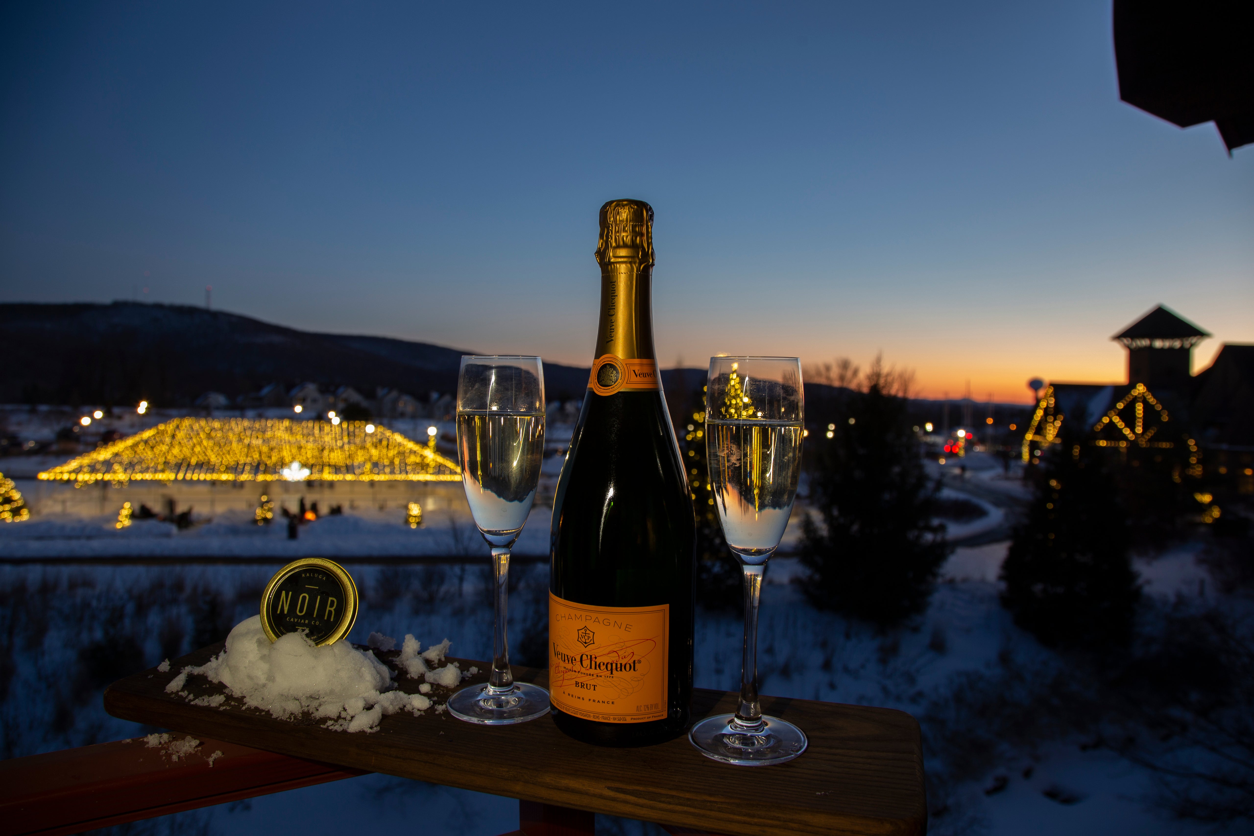 Bottle of Veuve Clicquot and two champagne glasses 